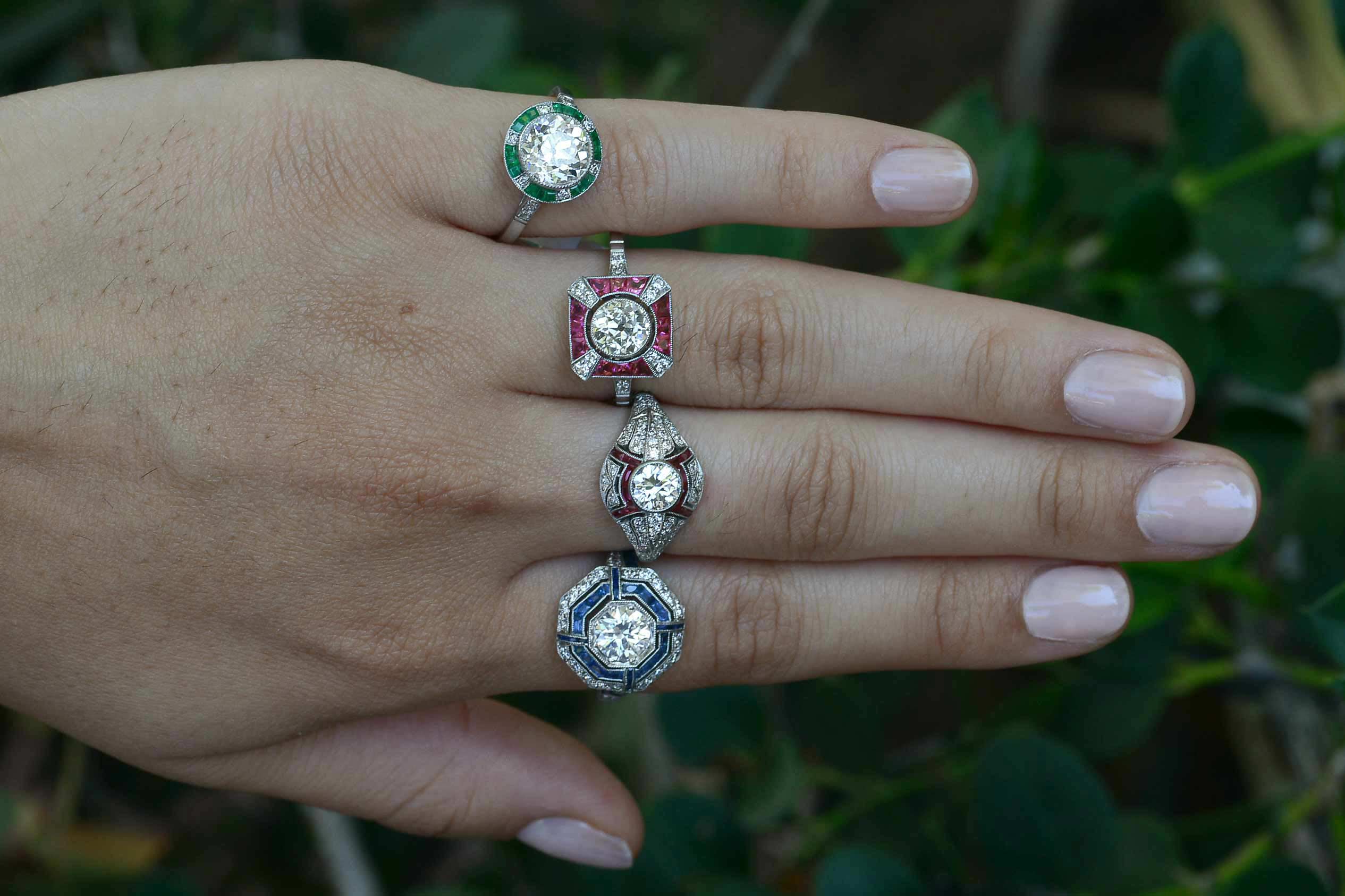 Art Deco style diamond and gem halo engagemnt rings.