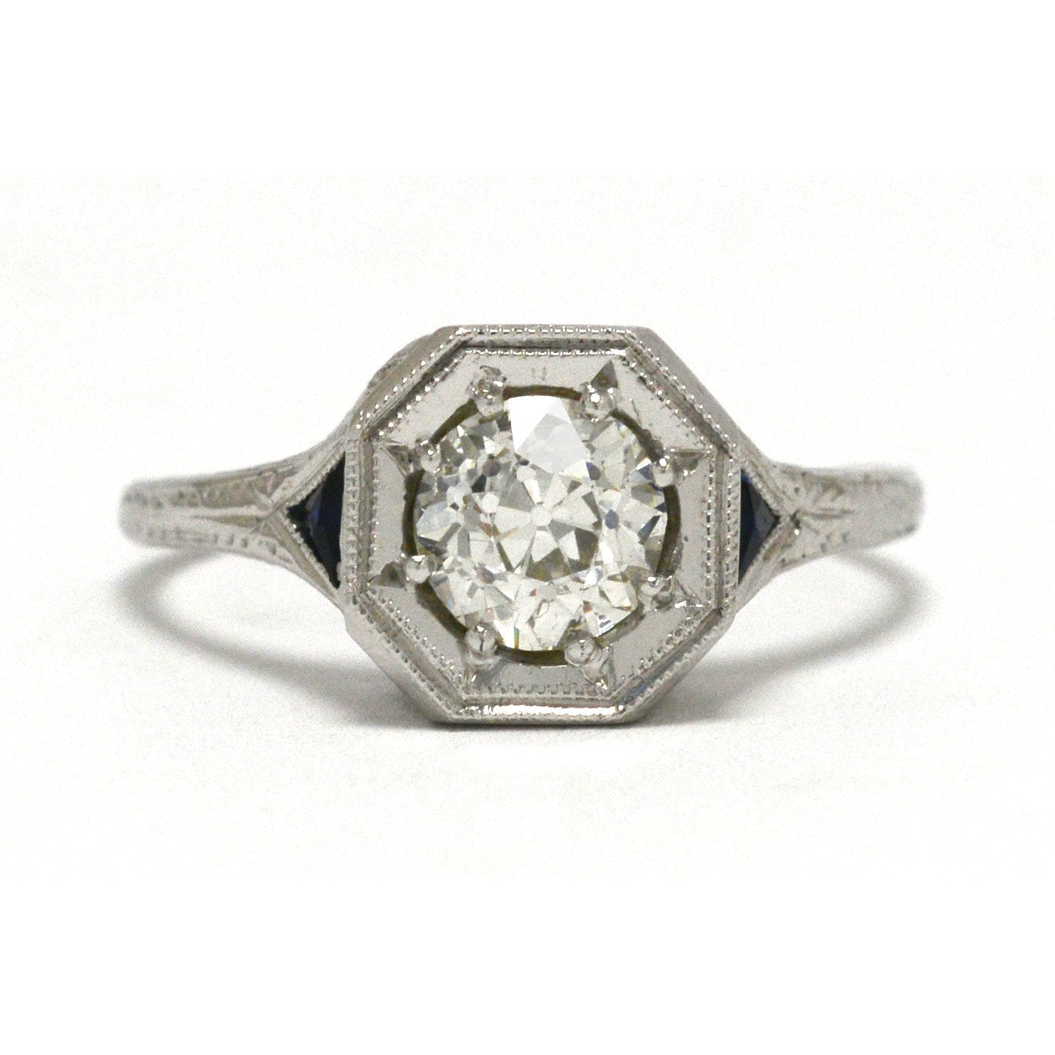 An antique old european diamond three stone engagement ring with sapphires.