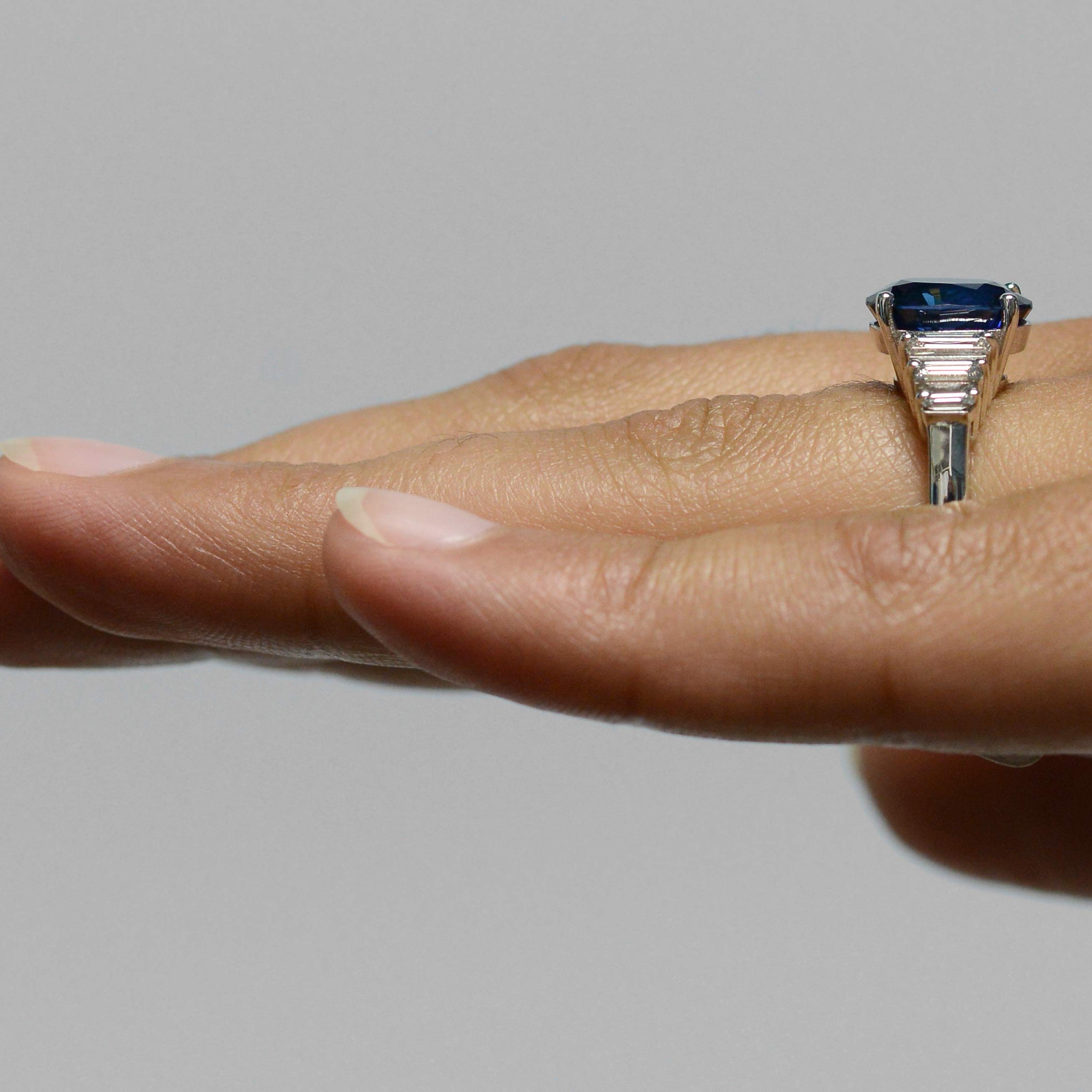 A vivid, royal blue sapphire, 18k white gold engagement ring.