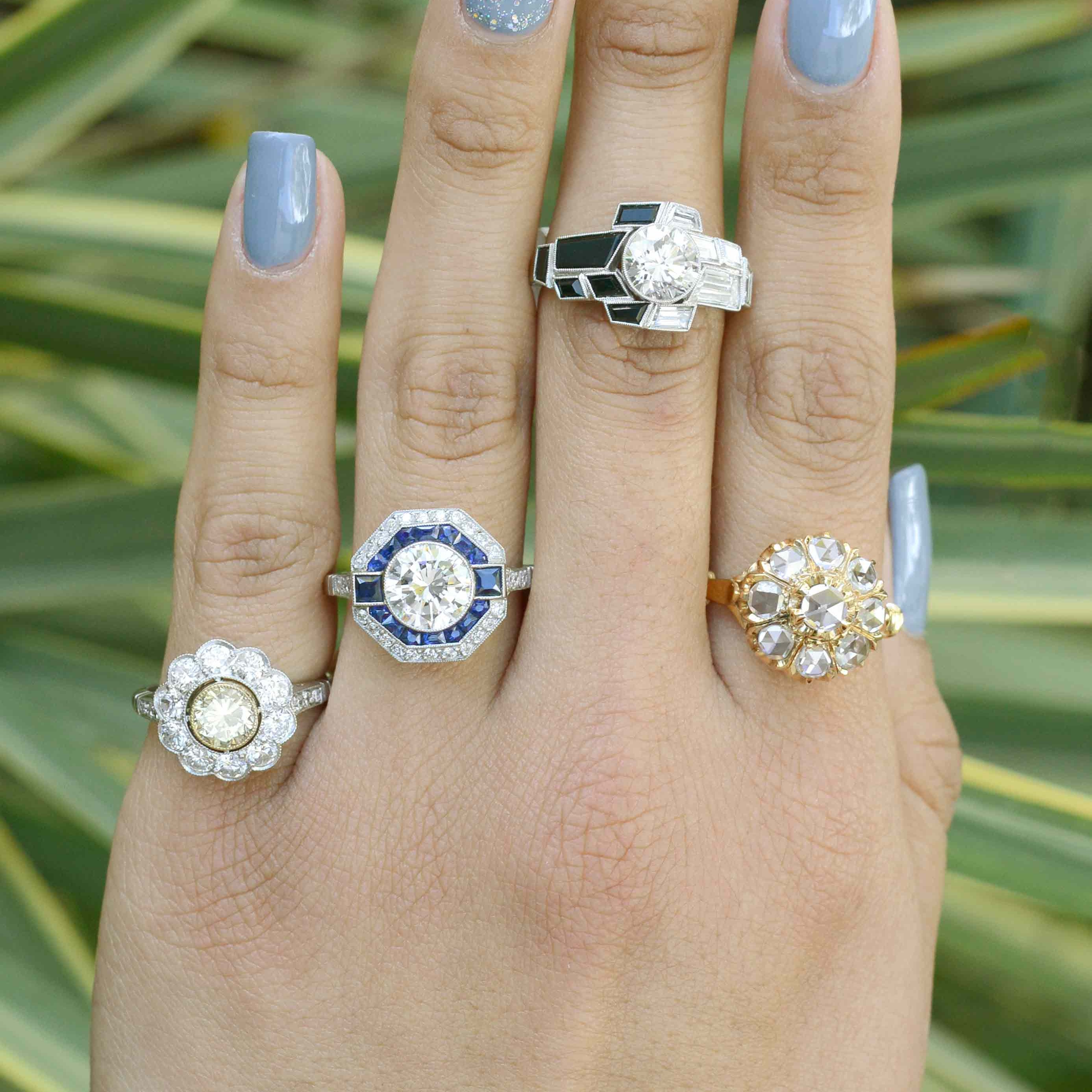 A collection of diamond cluster engagement rings.