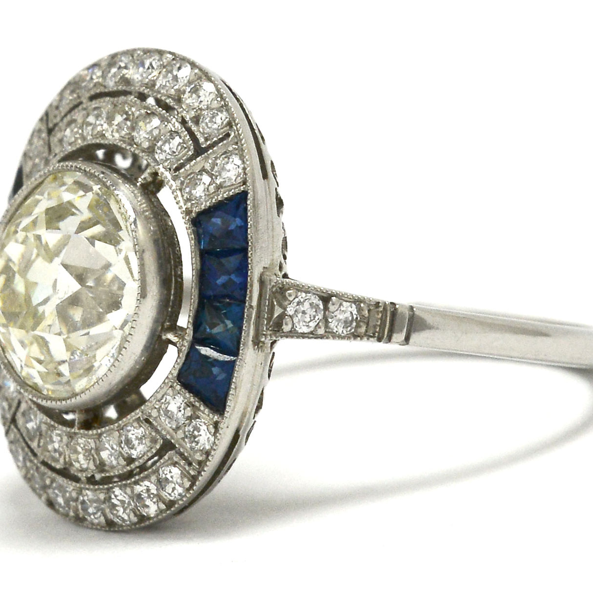 An antique diamond is set in an Art Deco revival engagement ring.