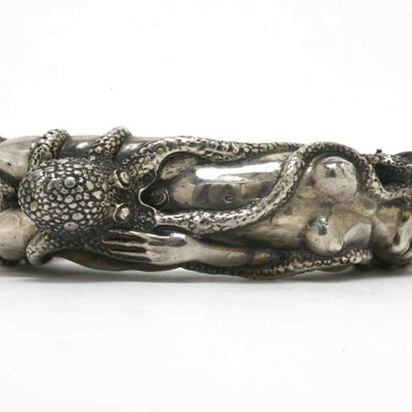 this nude lady silver cuff fits wrists between 6 to 7 inches.