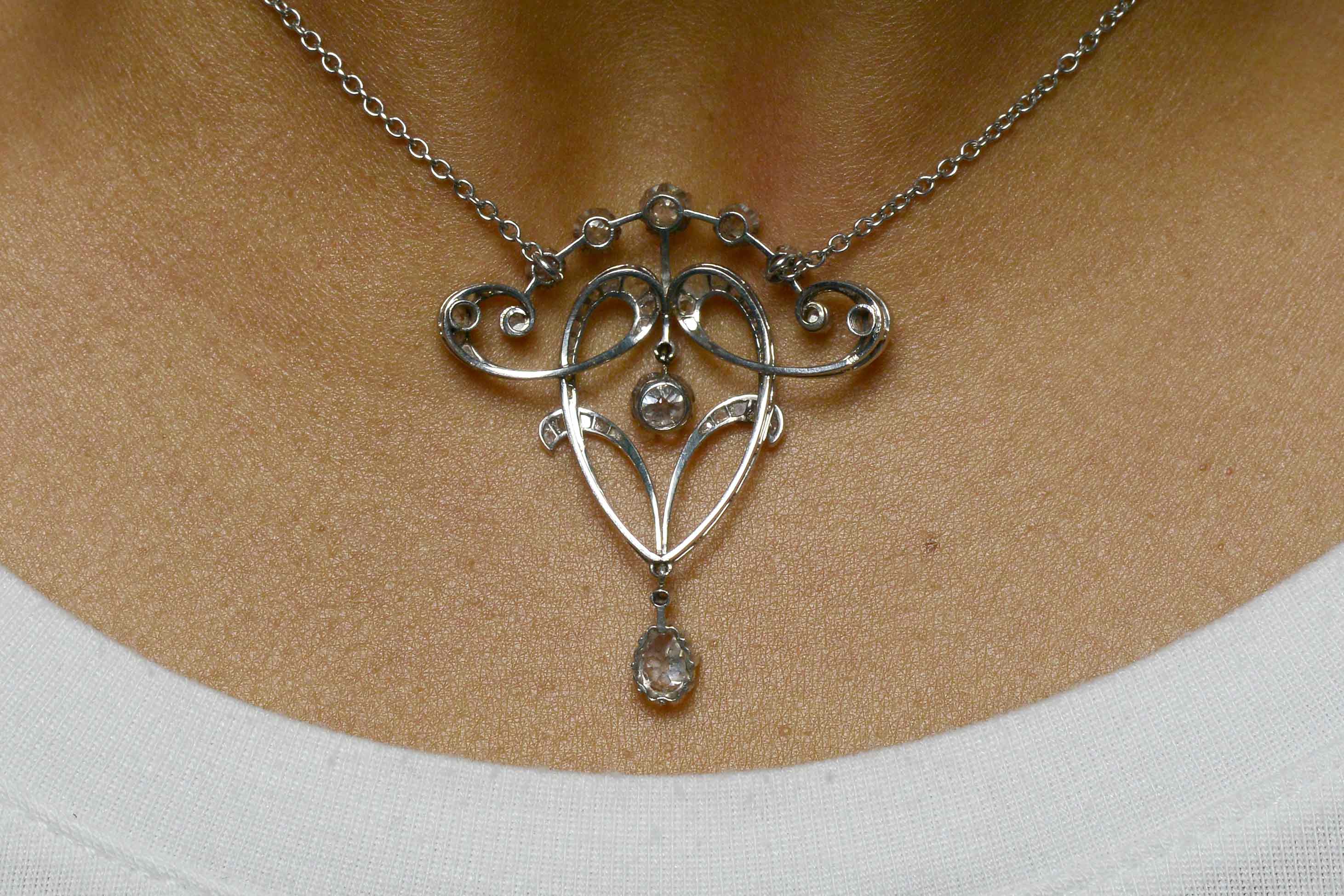 Old mine and rose cut diamond platinum pendant necklace.
