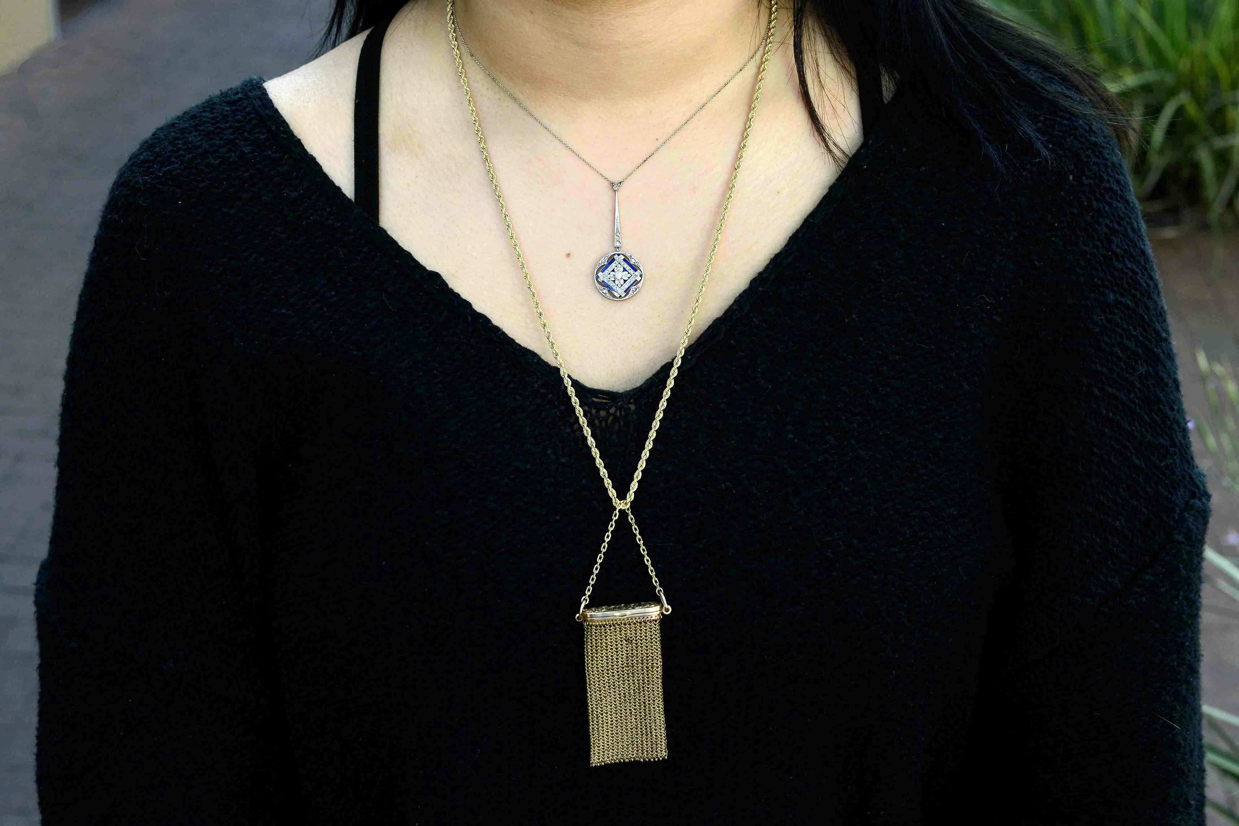 A platinum and yellow gold antique diamond pendant necklace.