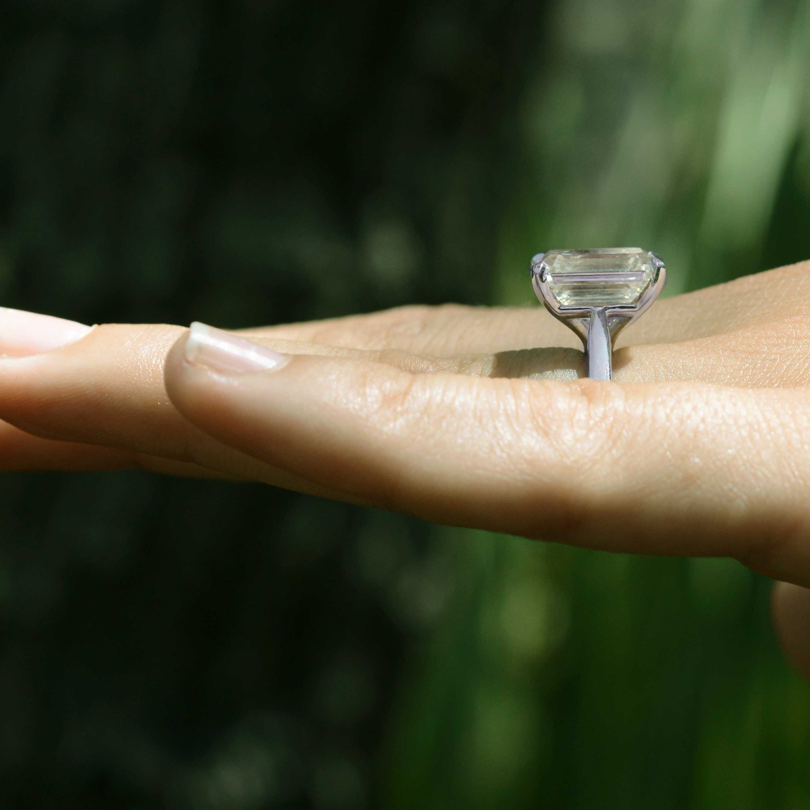 A tall 8 carat diamond solitaire ring.