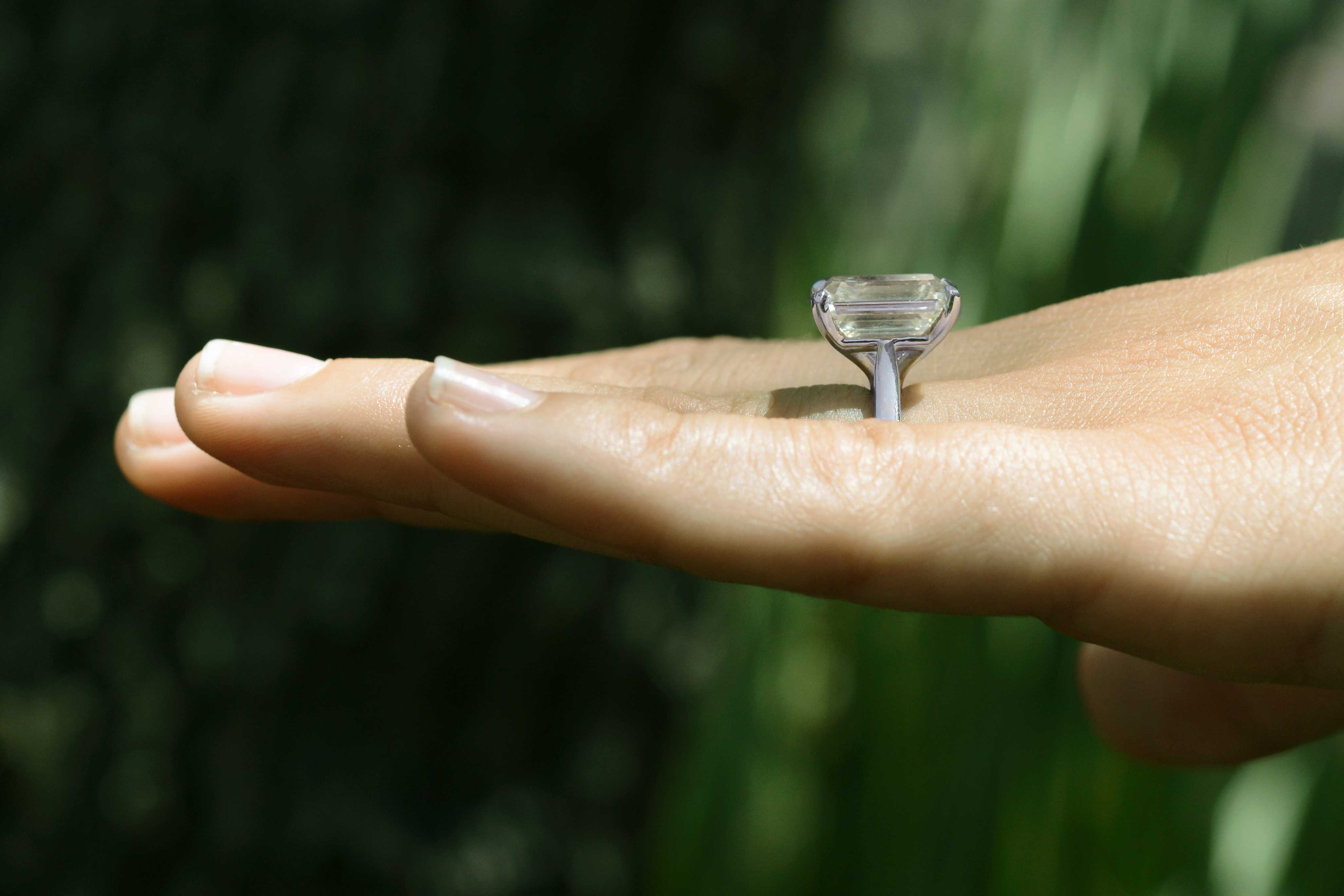 A tall 8 carat diamond solitaire ring.