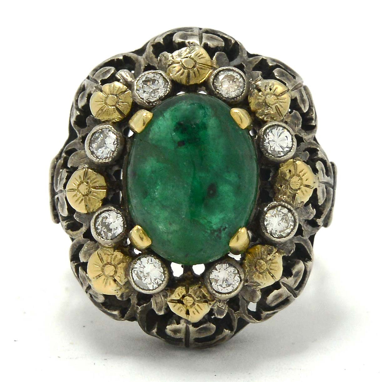 This Victorian antique ring has a 3 carat oval emerald, accented with diamonds and flowers.