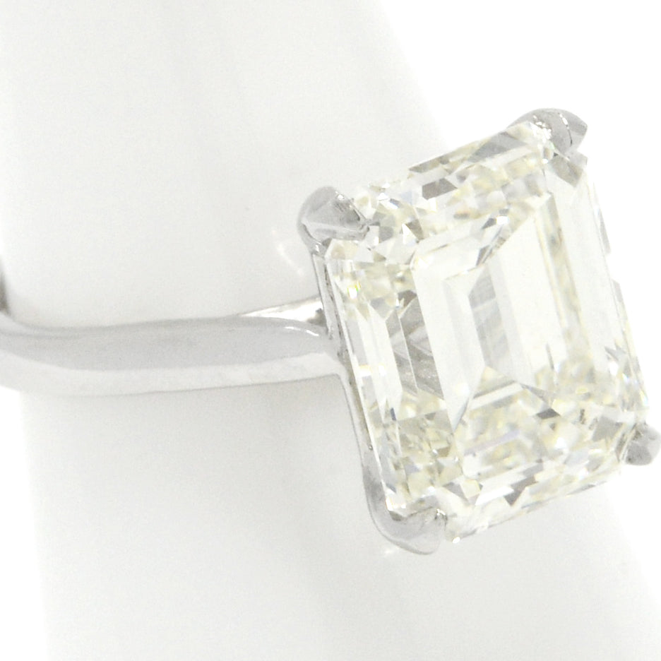 An 8 carat emerald cut diamond in a platinum setting.