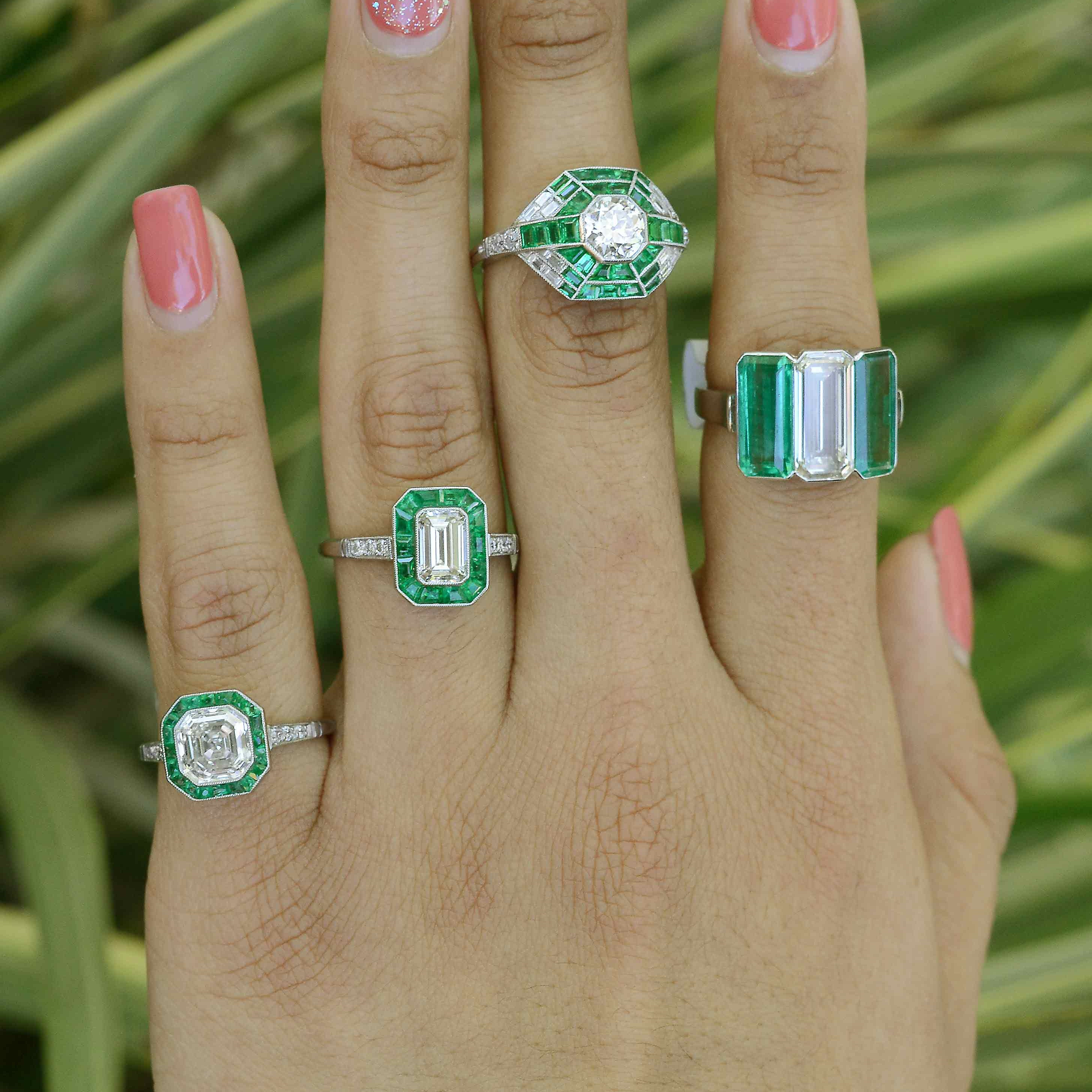 Some of our big diamond wedding rings with emerald gem accents.