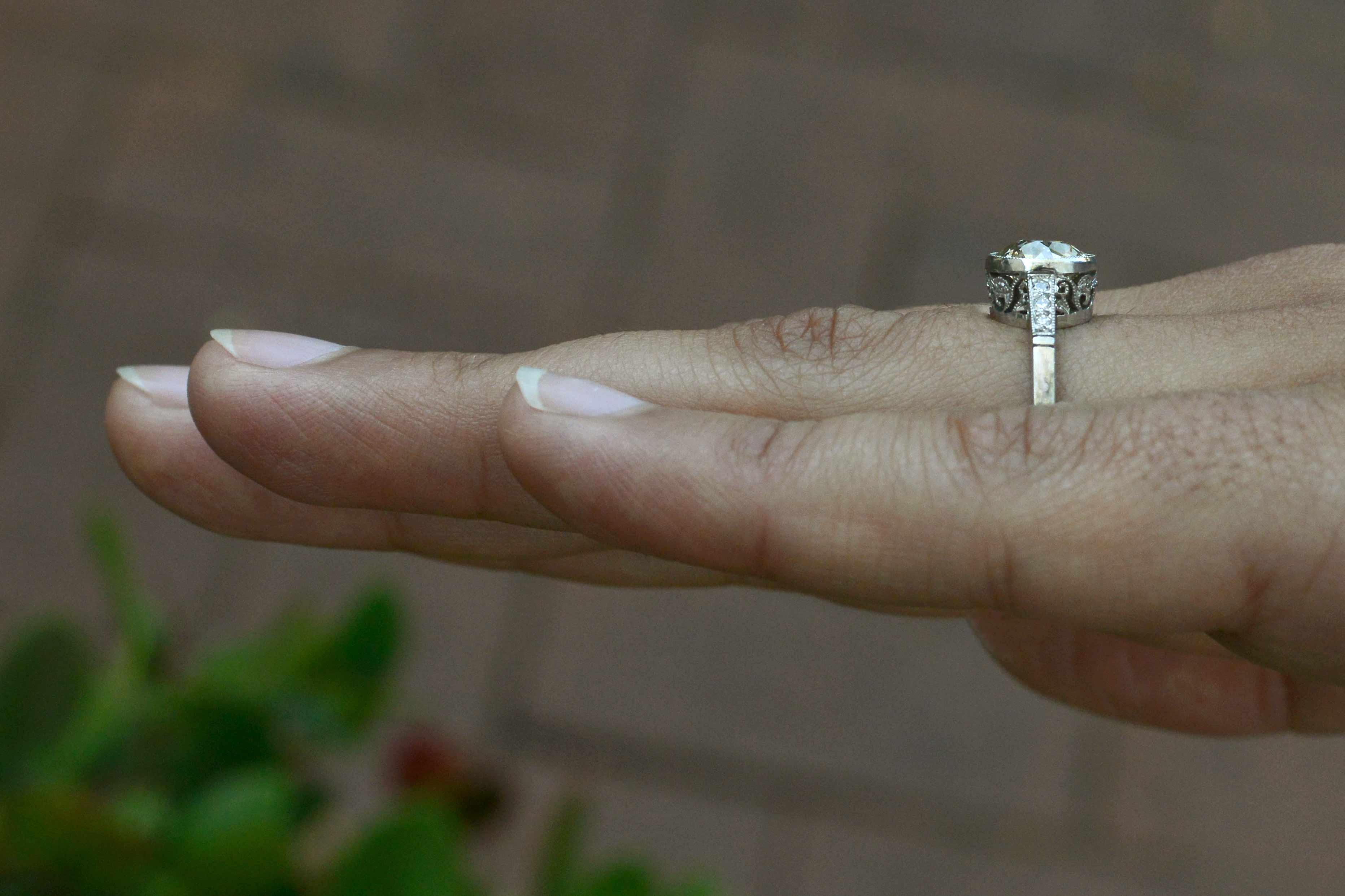 A look at the milgrain diamond bezel setting of this solitaire.