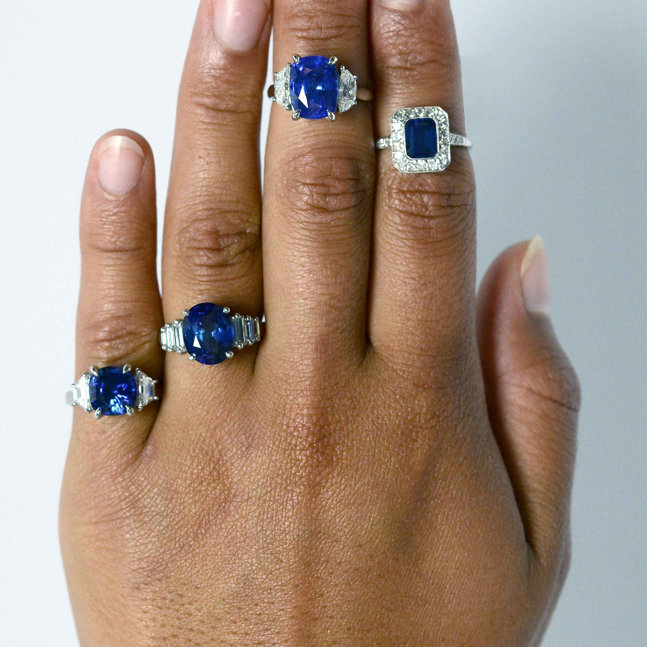 Dark blue sapphire engagement rings with diamonds.