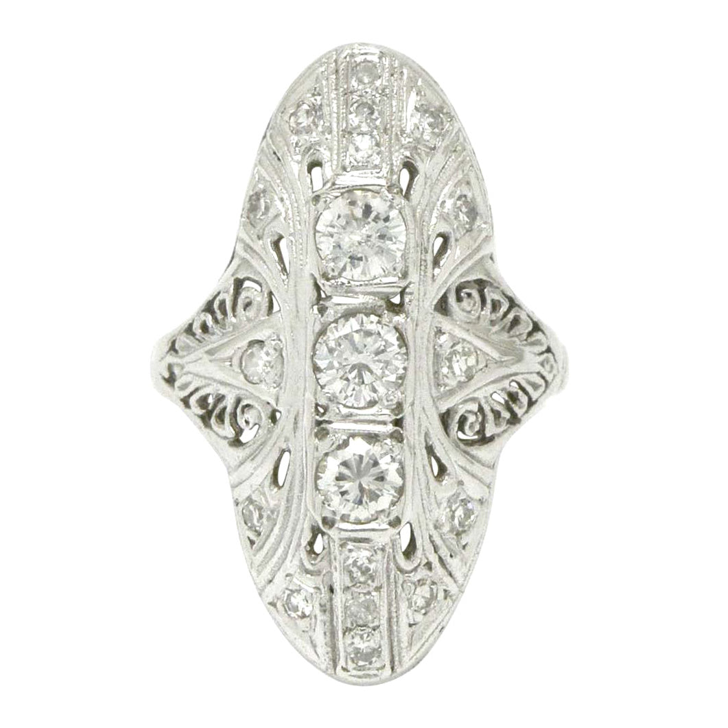 A navette shape ring with diamonds.