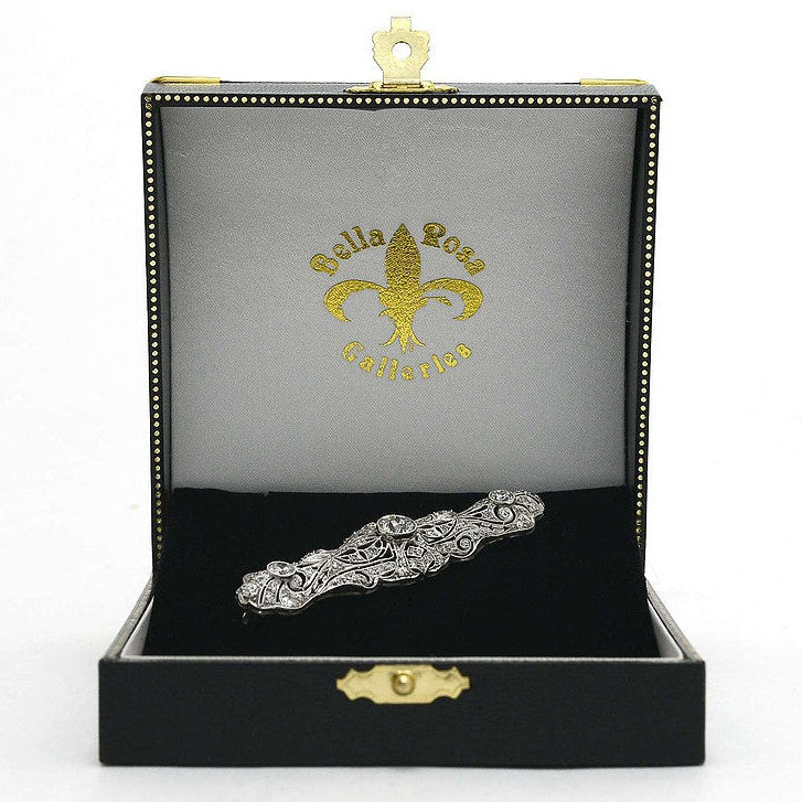 A delicate antique filigree diamonds brooch pin.