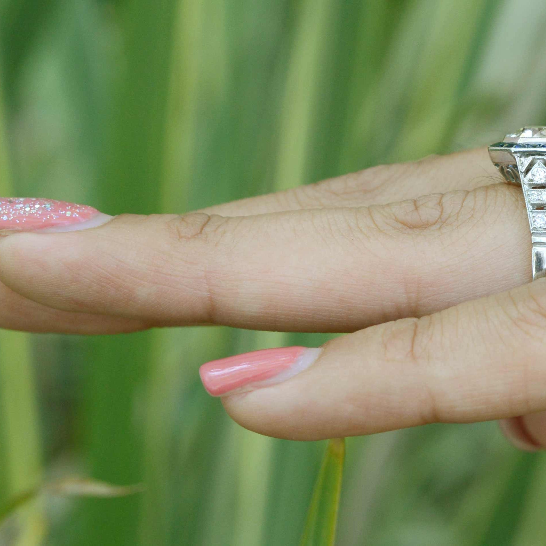 There are filigree accents on the side of this platinum wedding ring.