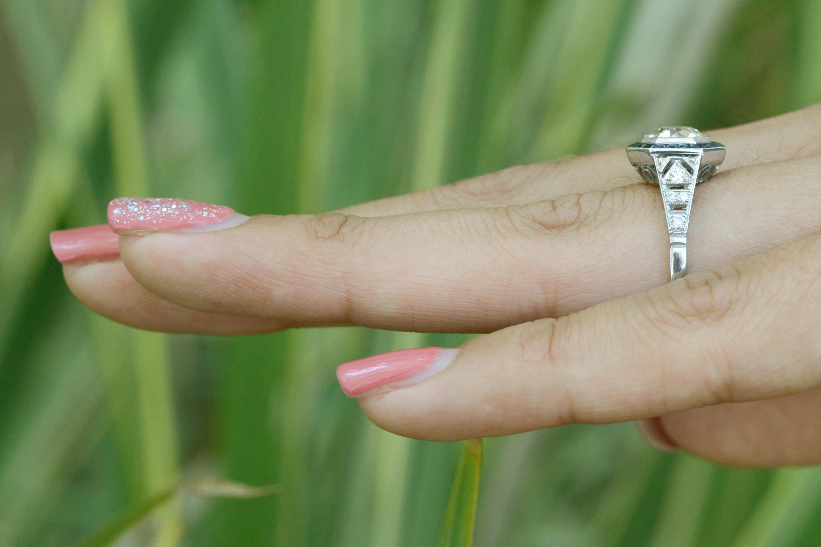 There are filigree accents on the side of this platinum wedding ring.