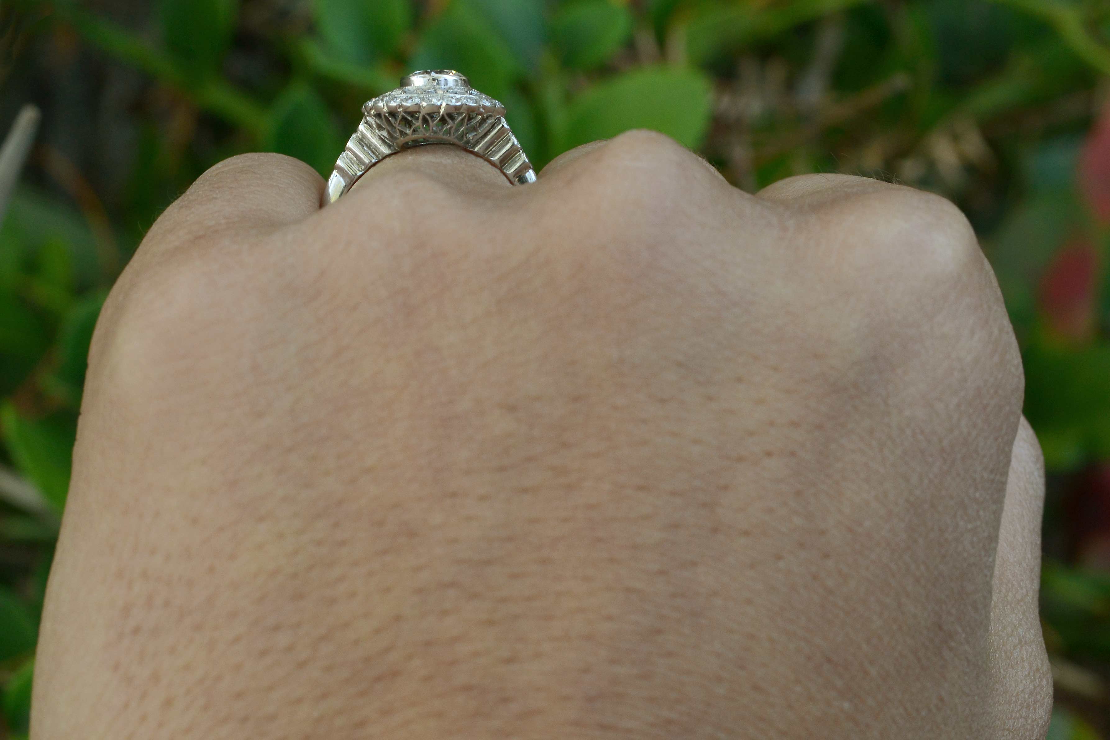 Webbed filigree and stepped tapered diamond band.