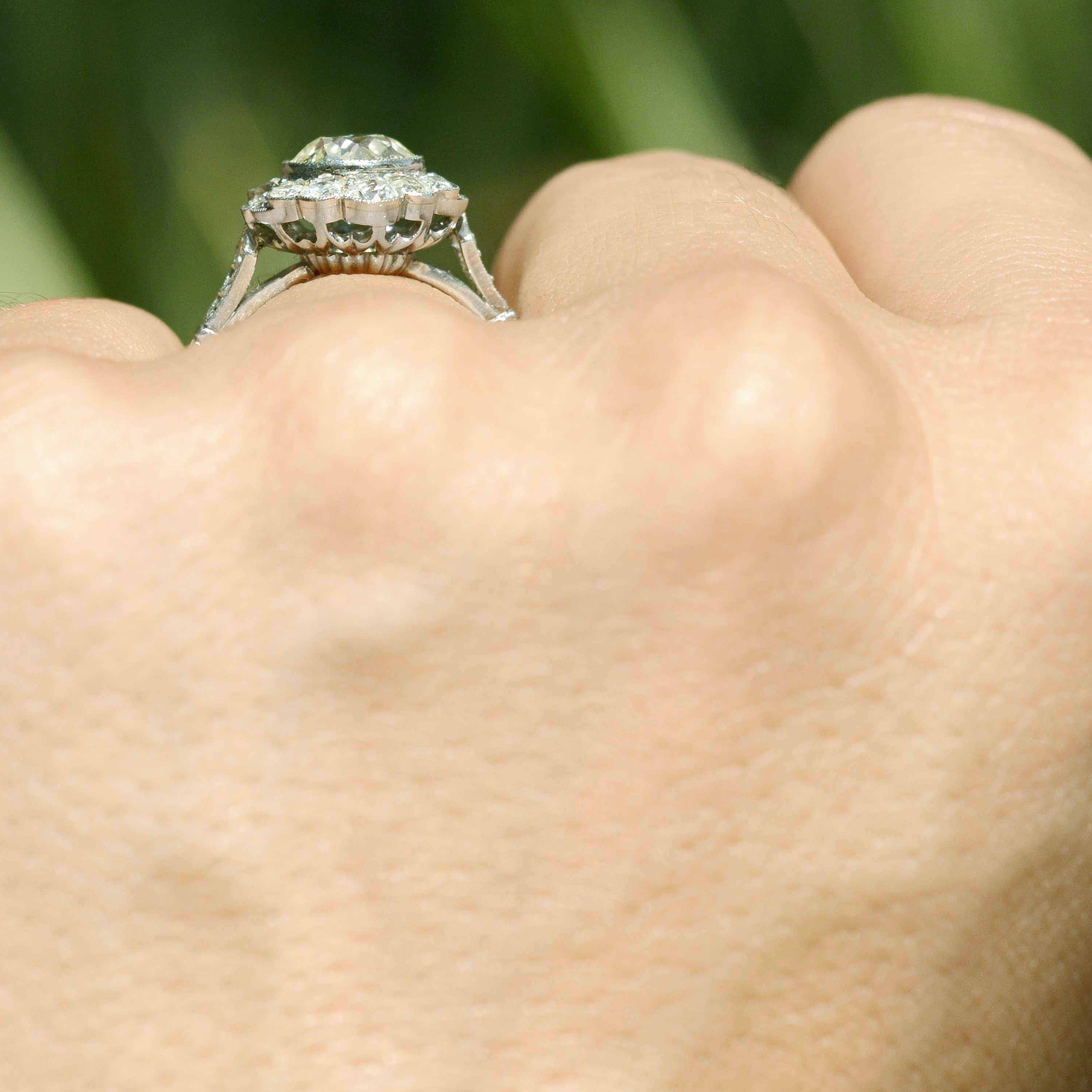A cluster floral filigree diamond ring.