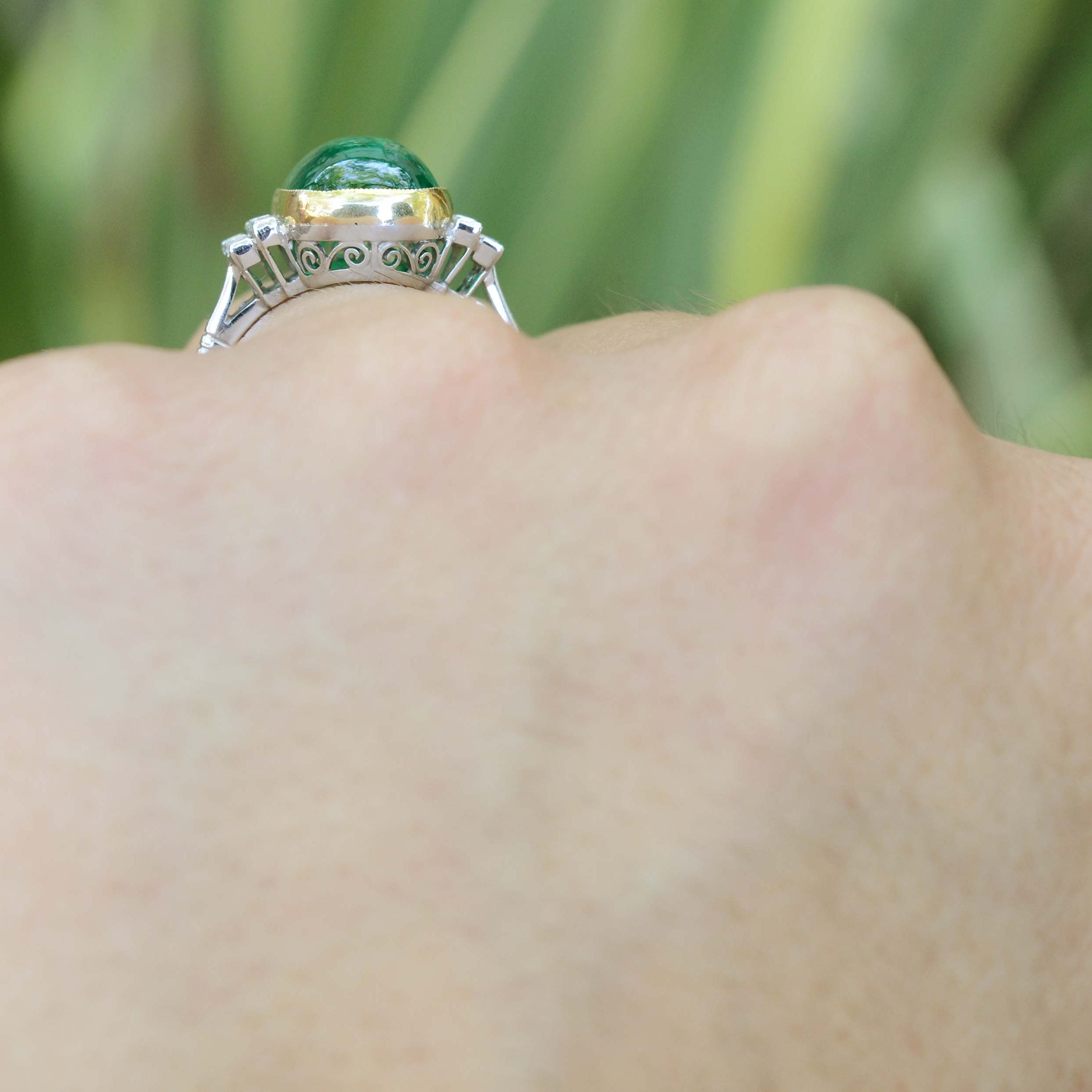 A large four carat cabochon dome emerald ring.