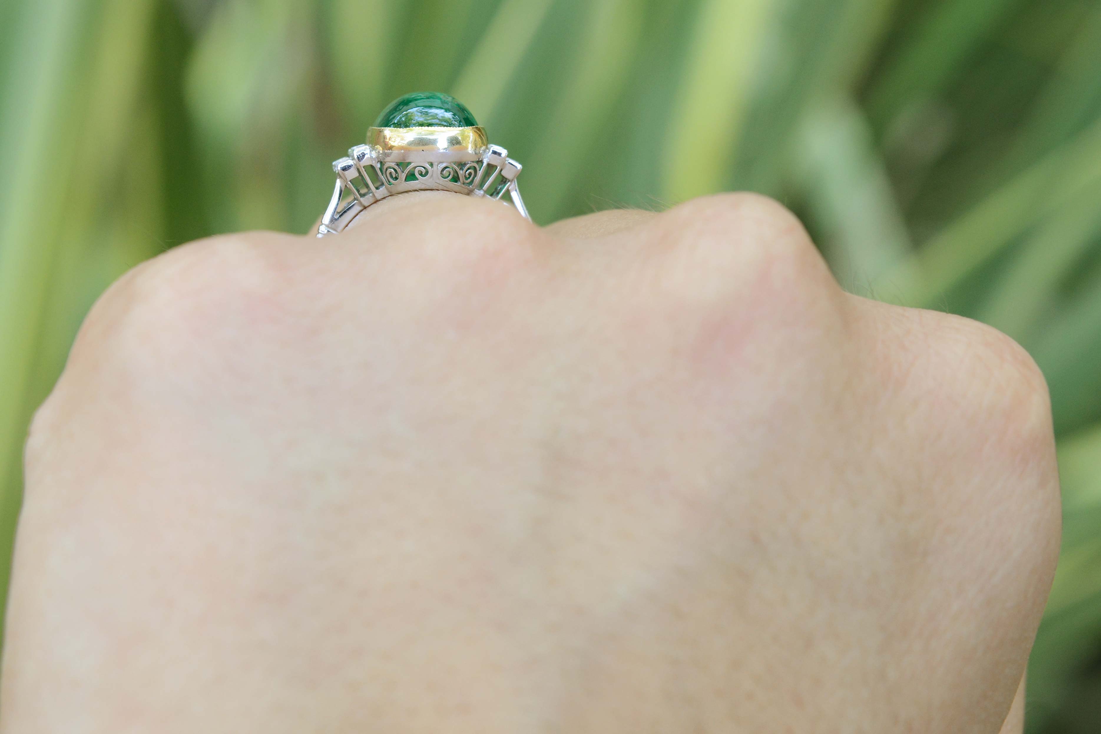 A large four carat cabochon dome emerald ring.