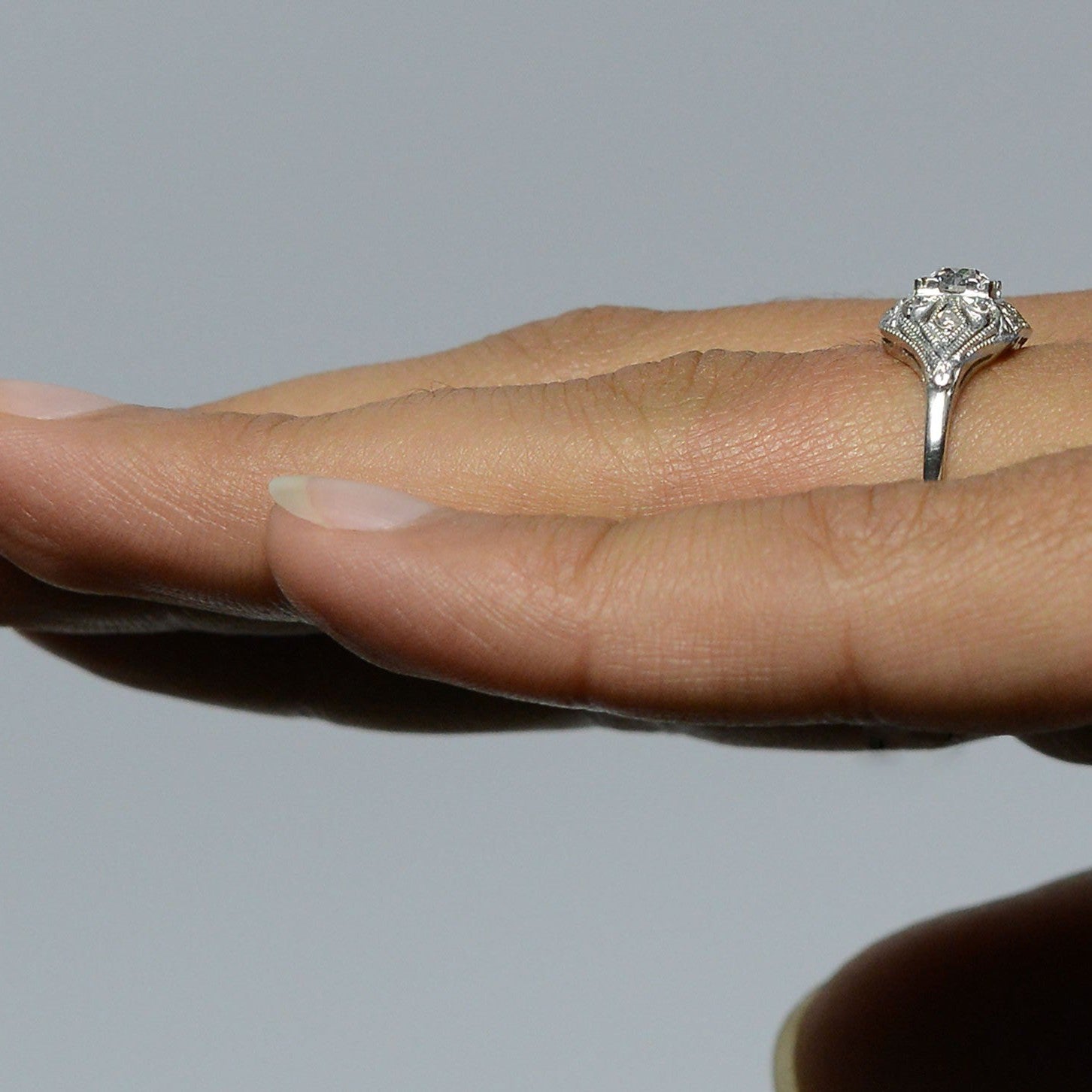 A fleur de lis pattern diamonds ring.