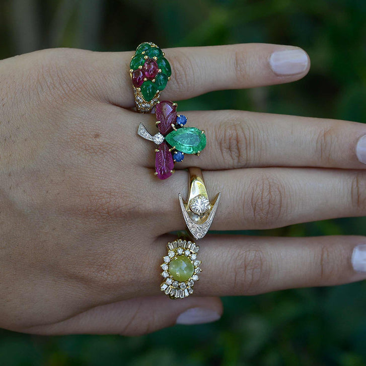 4 unique multi gemstone rings available from us.