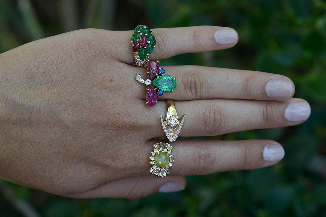 4 unique multi gemstone rings available from us.