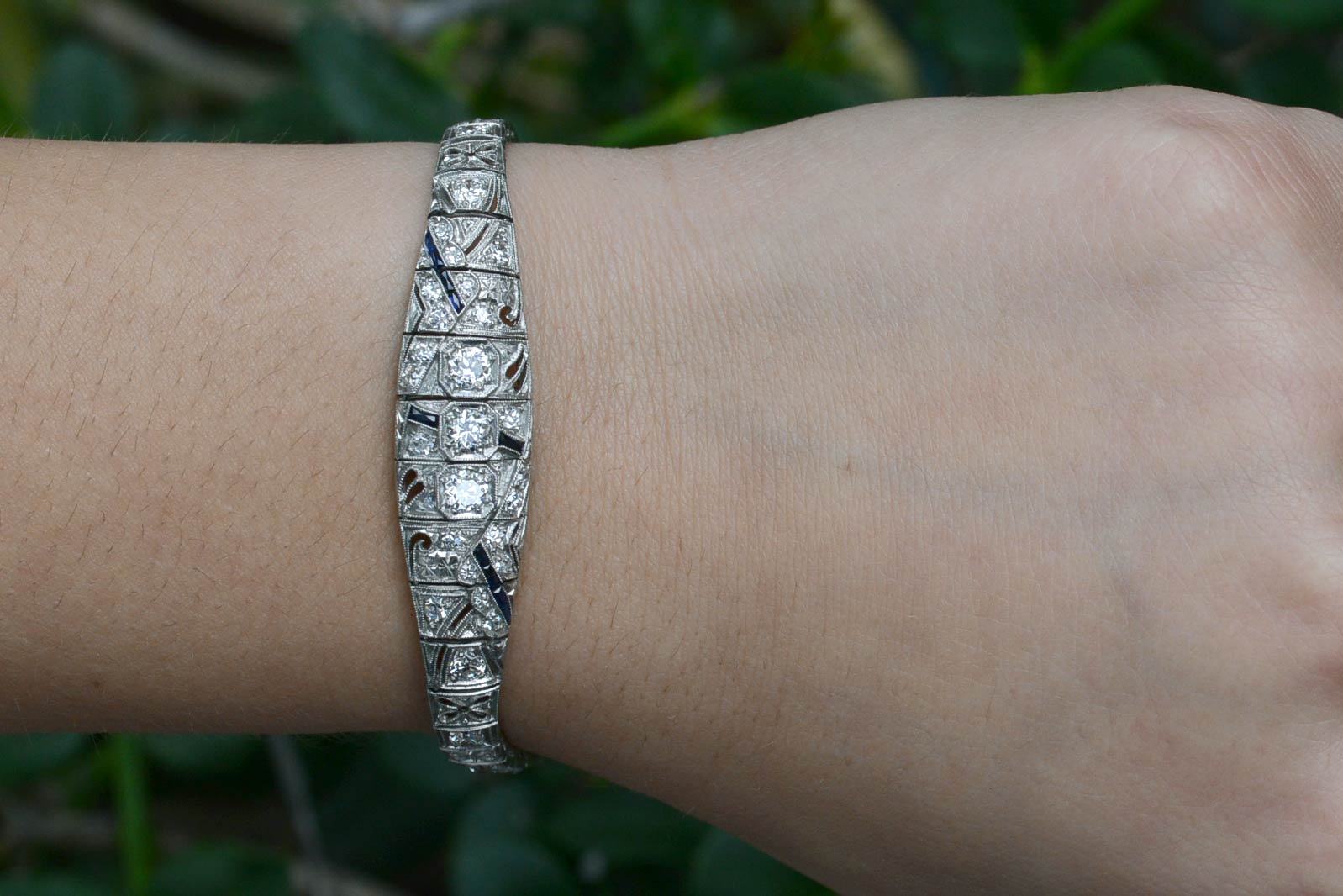 A flowers and geometric filigree decorated Art Deco antique platinum bracelet.