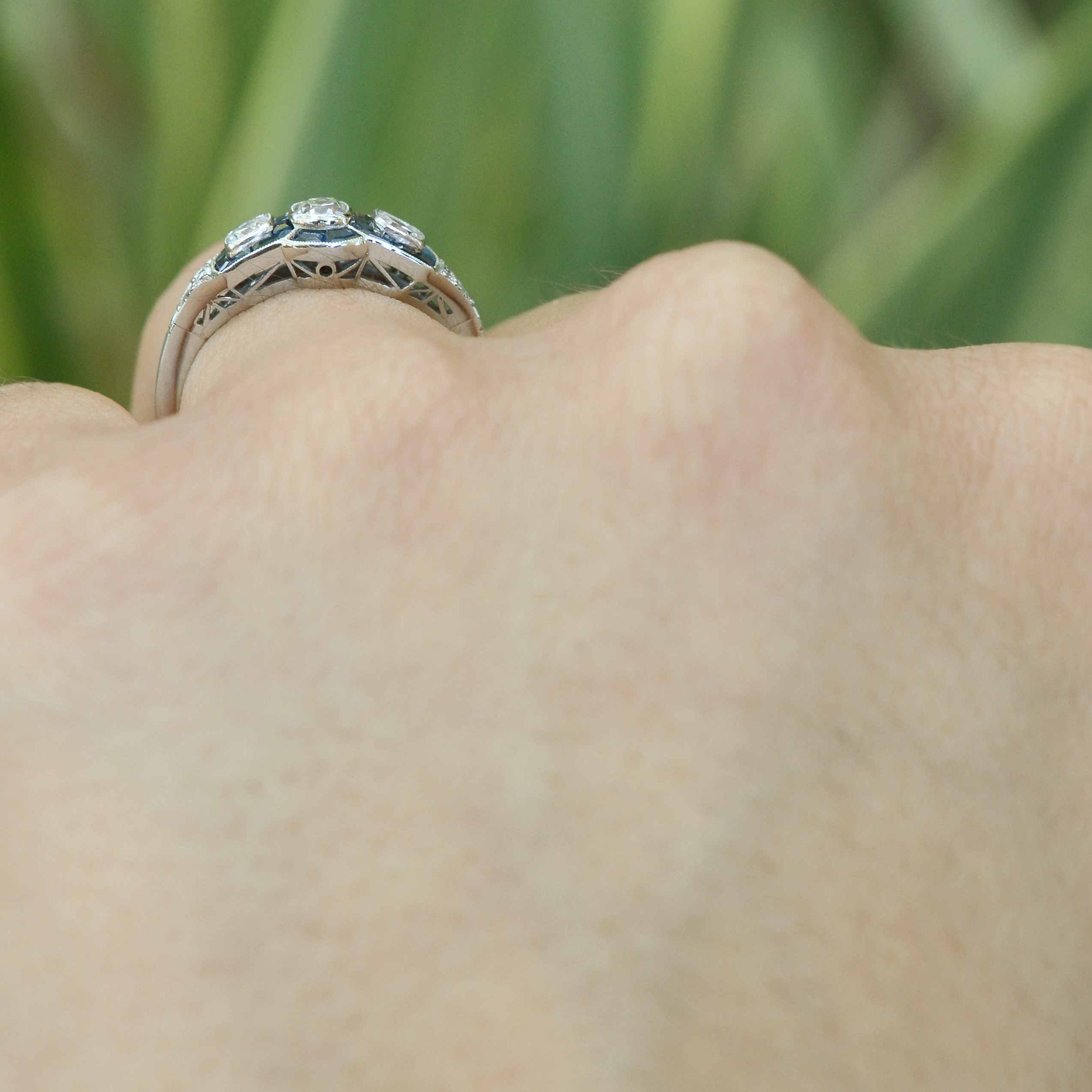 Three old mine cushion diamonds and sapphires engagement ring.