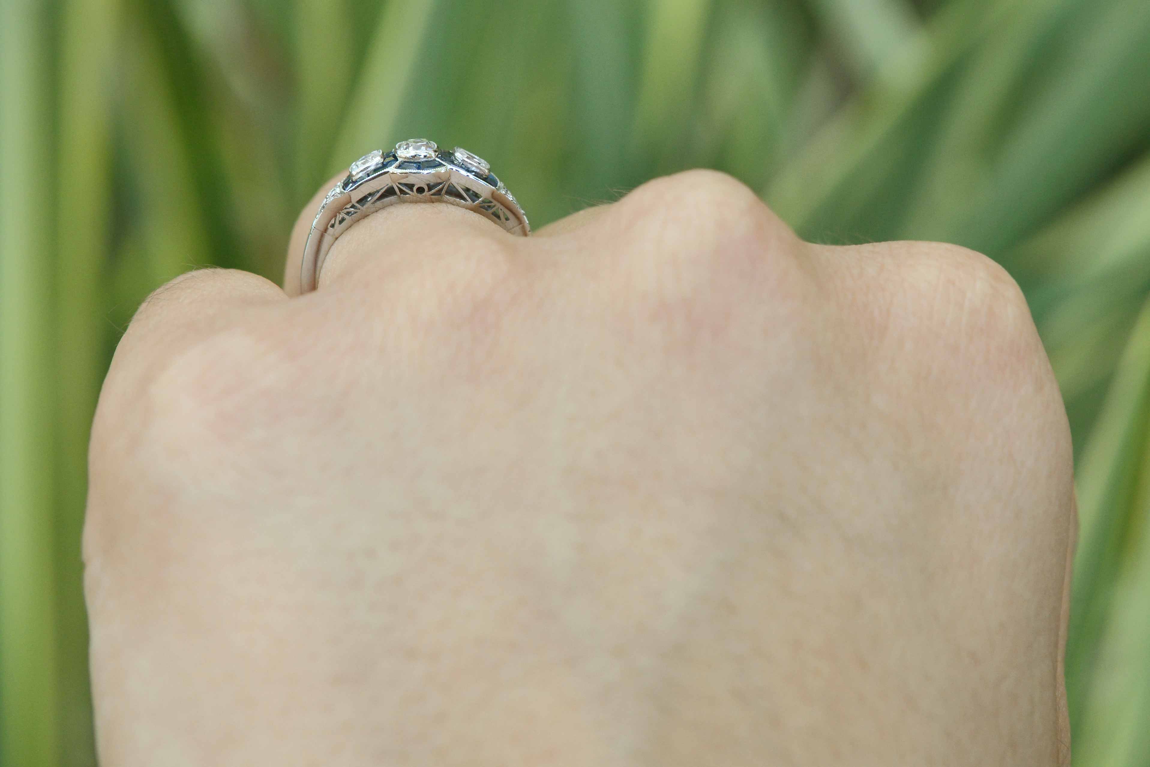 Three old mine cushion diamonds and sapphires engagement ring.