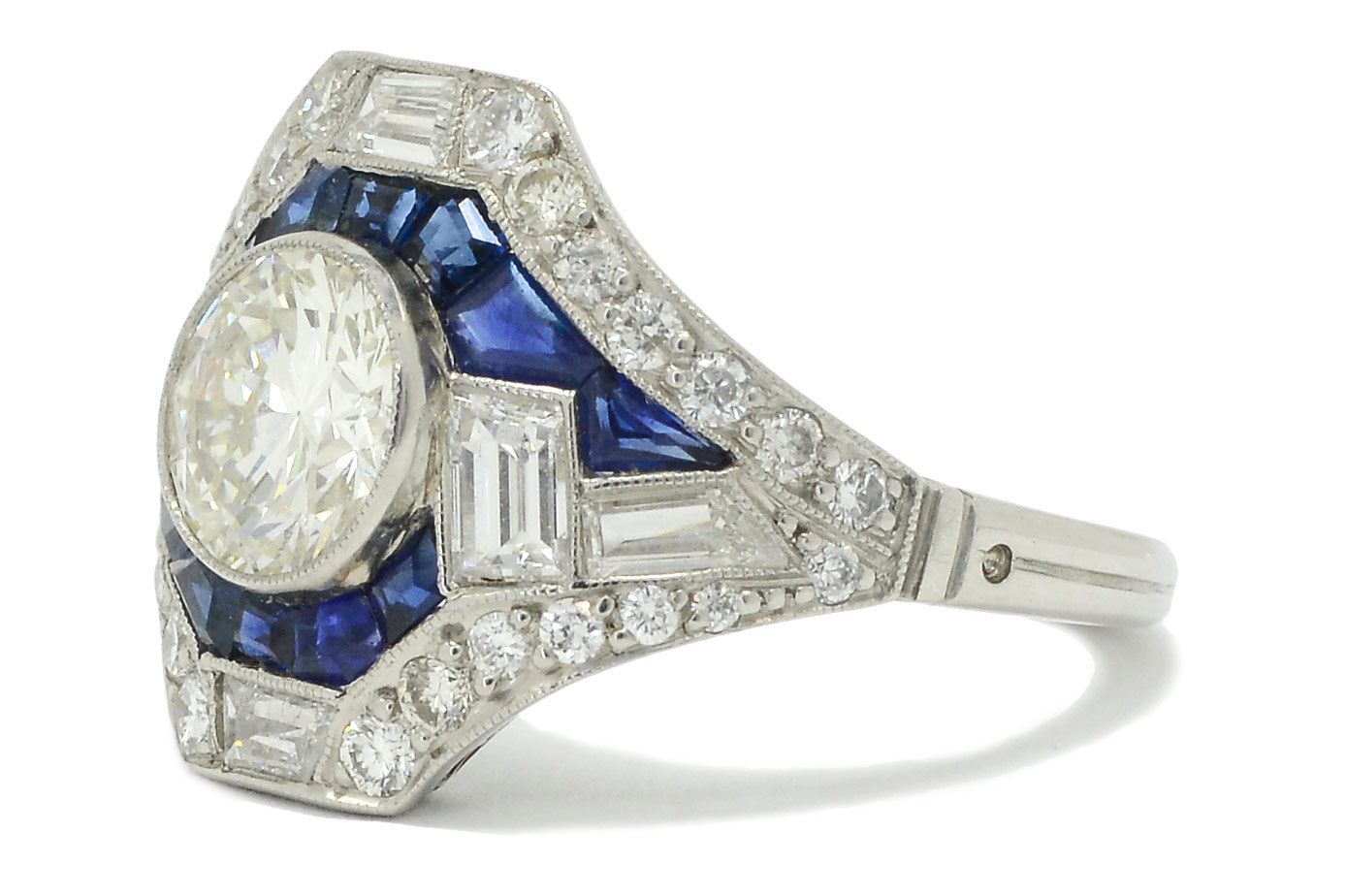 Centered by a milgrained bezel encircling a 1.20 carat round diamond of a dazzling VVS brilliance.