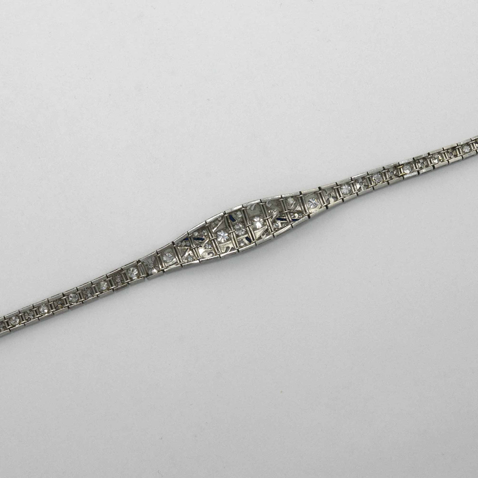 An Art Deco geometric design, filigree link bracelet with diamonds.