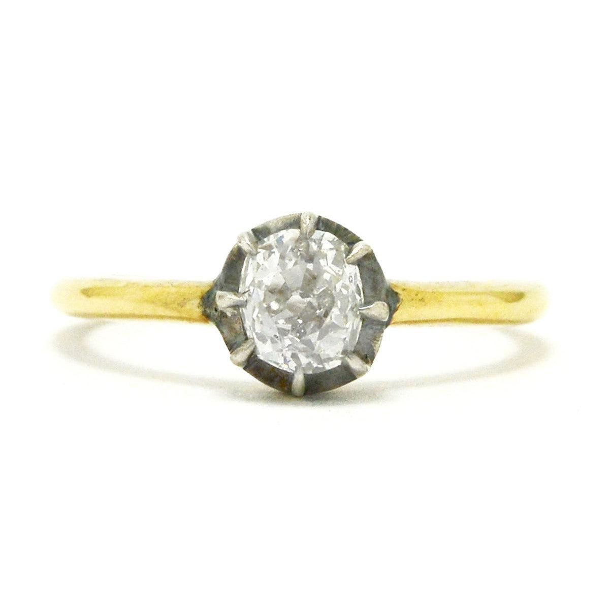 A silver and yellow gold Georgian style diamond solitaire ring.