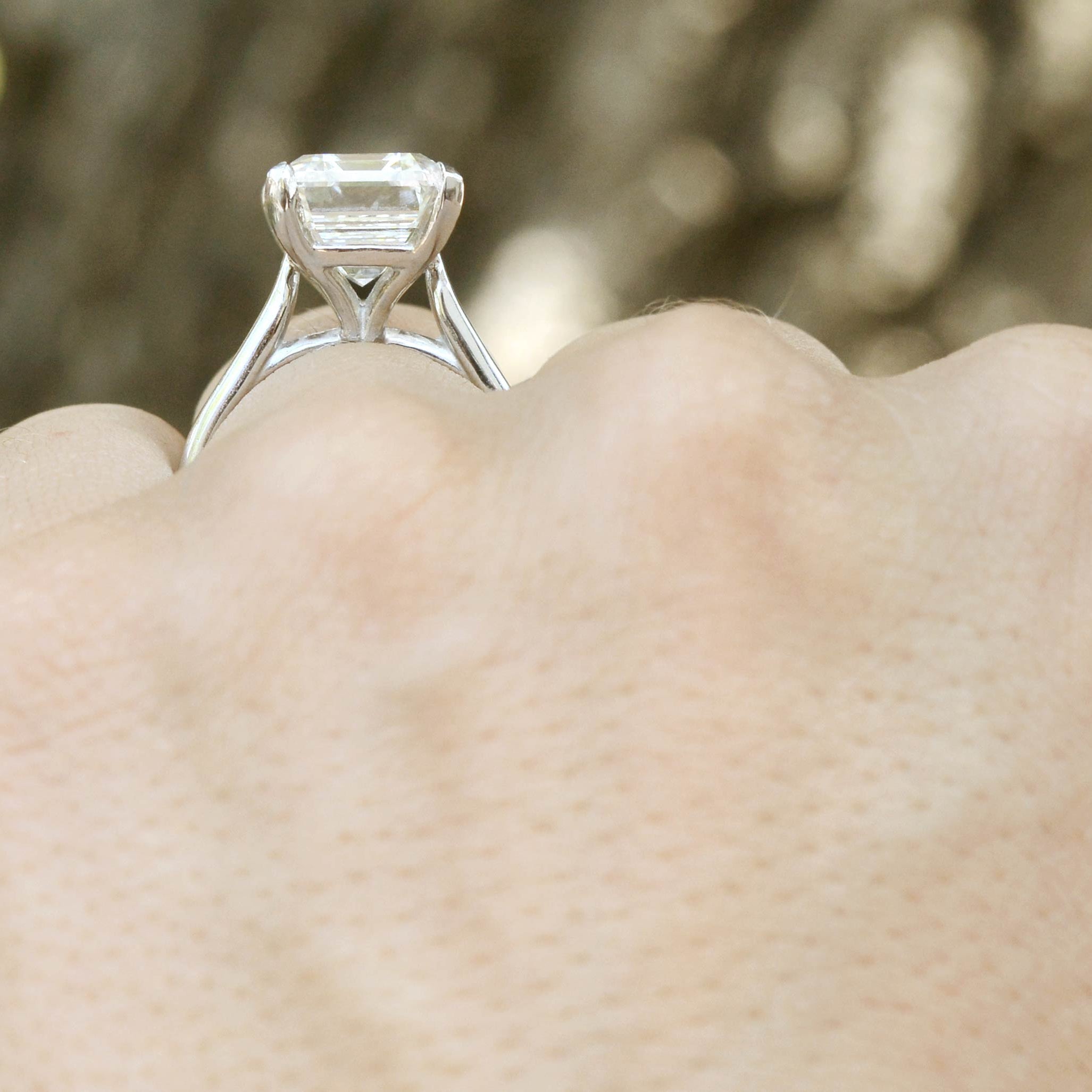 An Art Deco style emerald cut diamond solitaire.