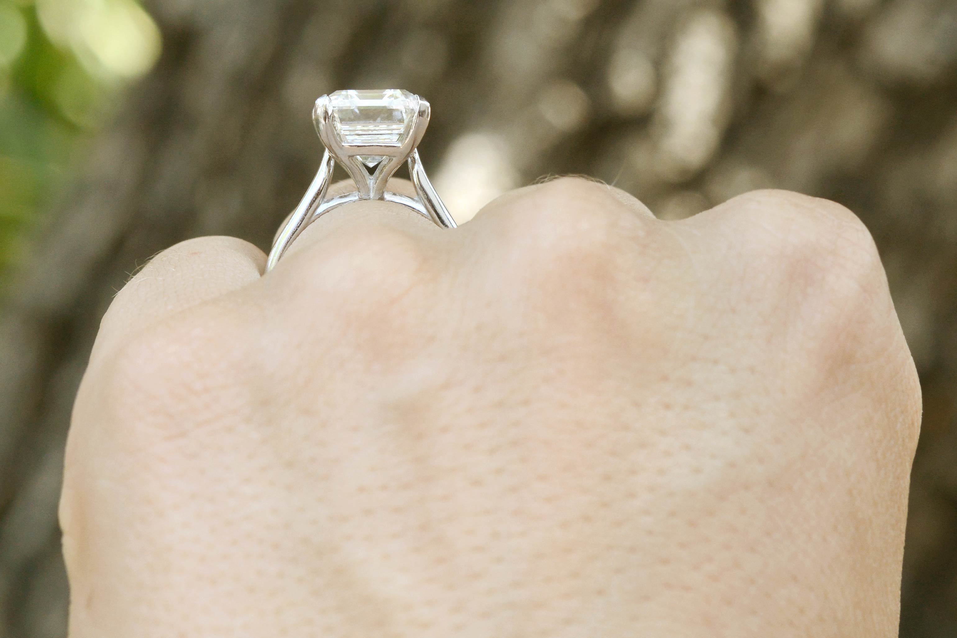 An Art Deco style emerald cut diamond solitaire.