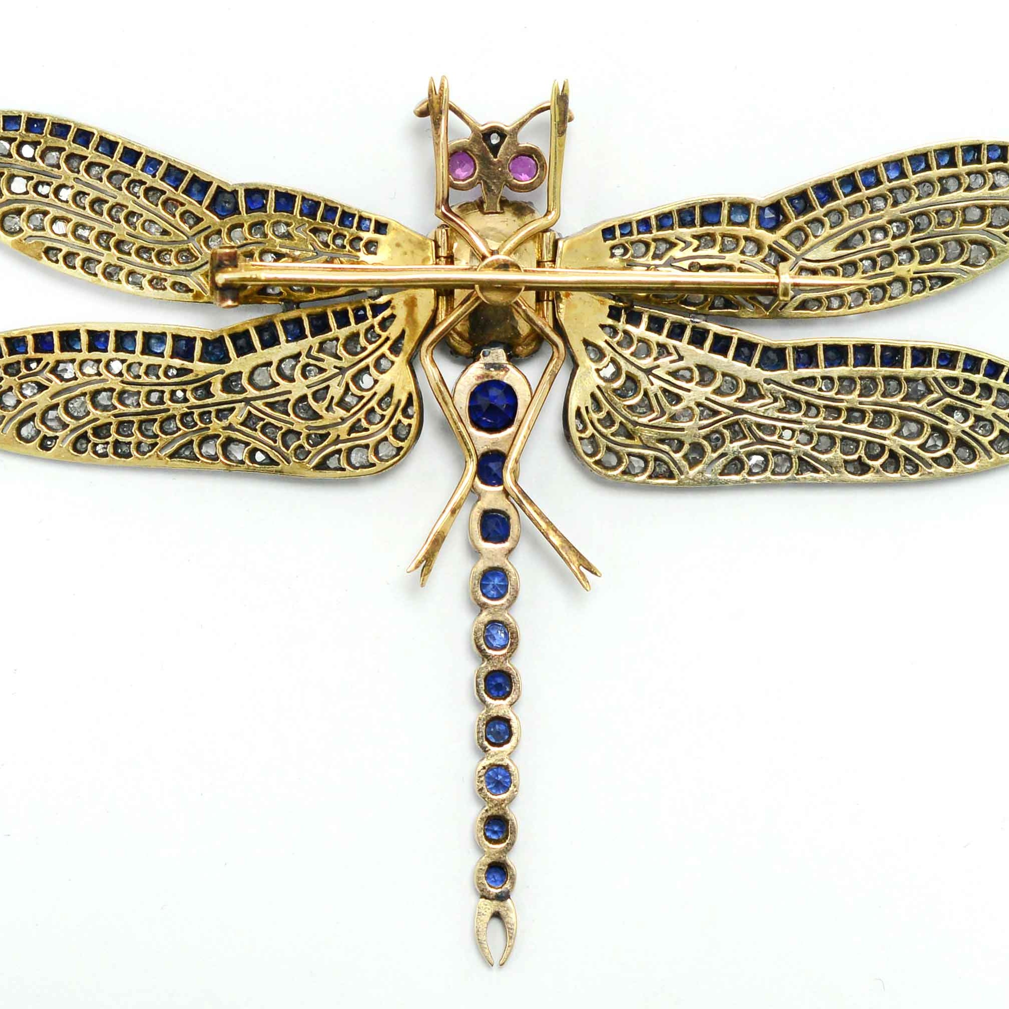 Blue sapphires and diamonds in a unique Art Nouveau revival dragon fly brooch.