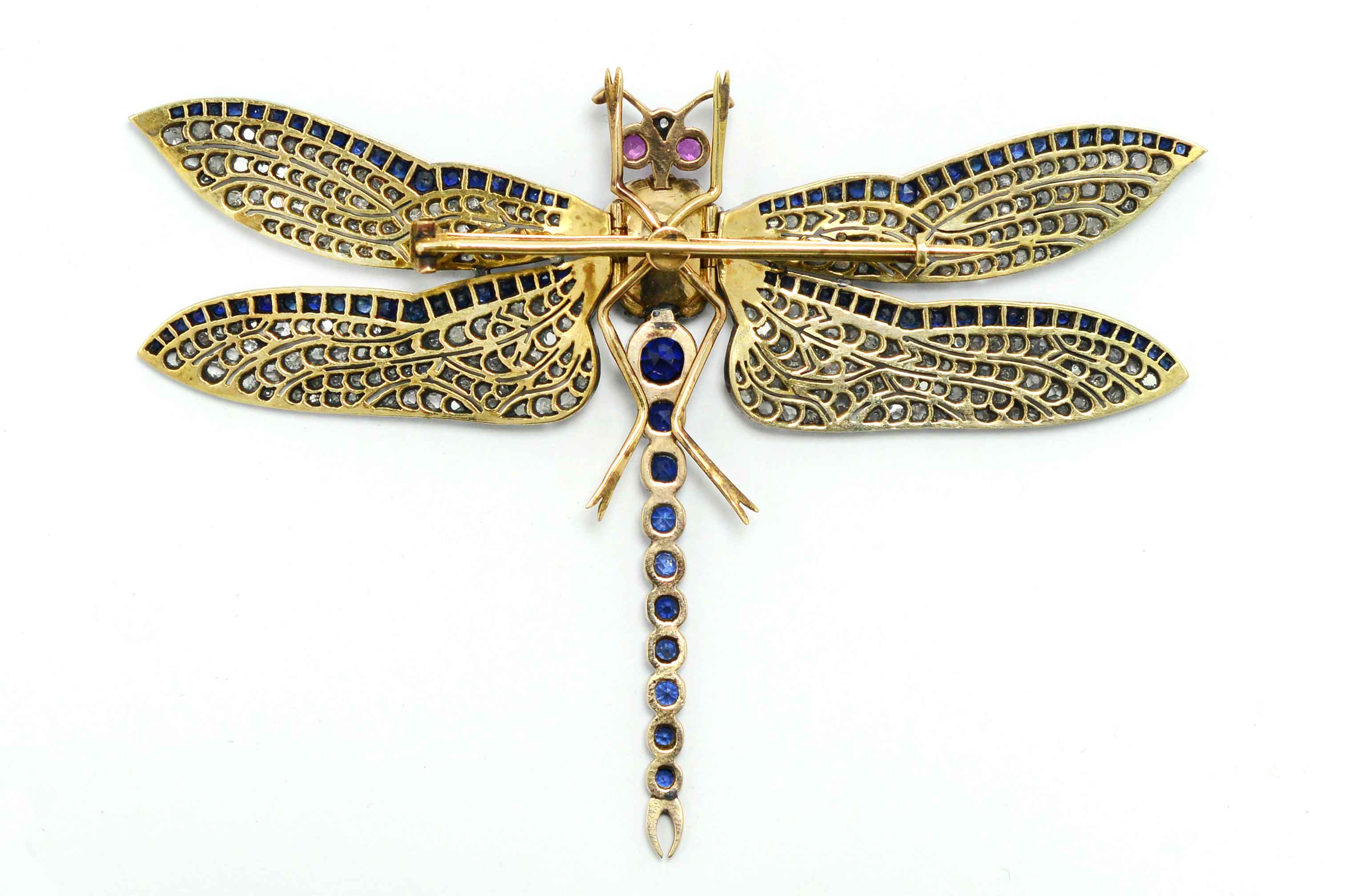 Blue sapphires and diamonds in a unique Art Nouveau revival dragon fly brooch.