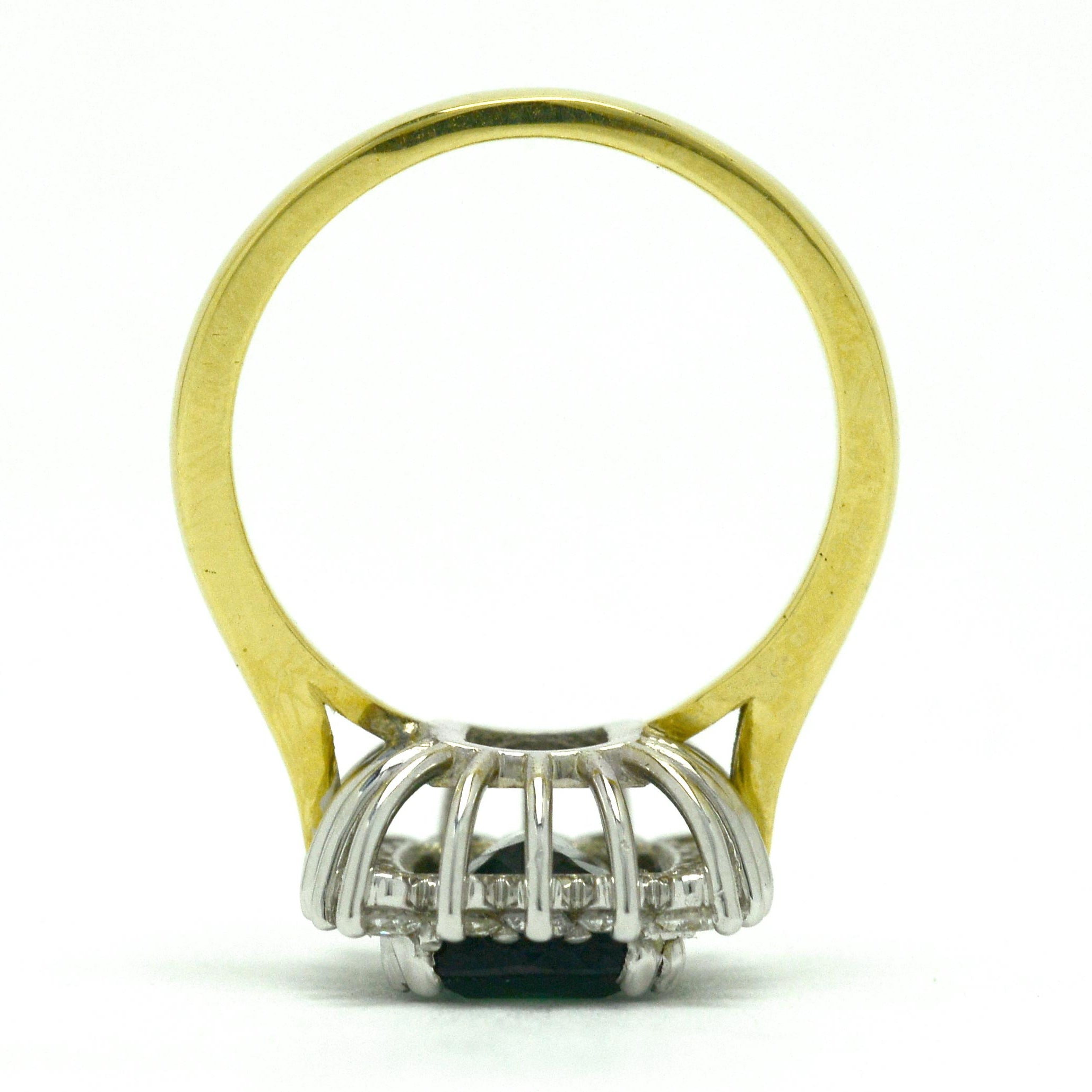 A white and yellow gold modern green tourmaline ring.