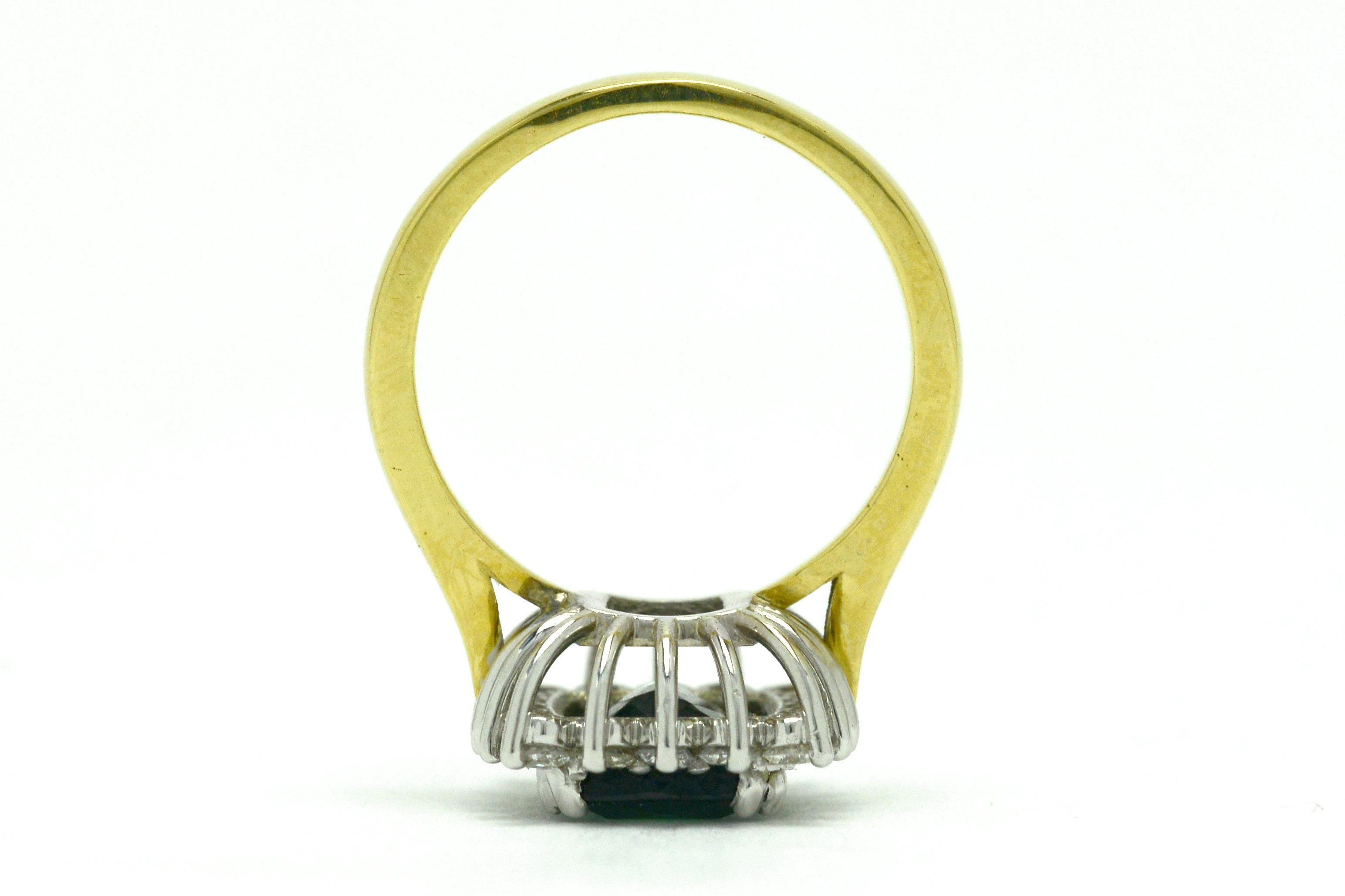 A white and yellow gold modern green tourmaline ring.