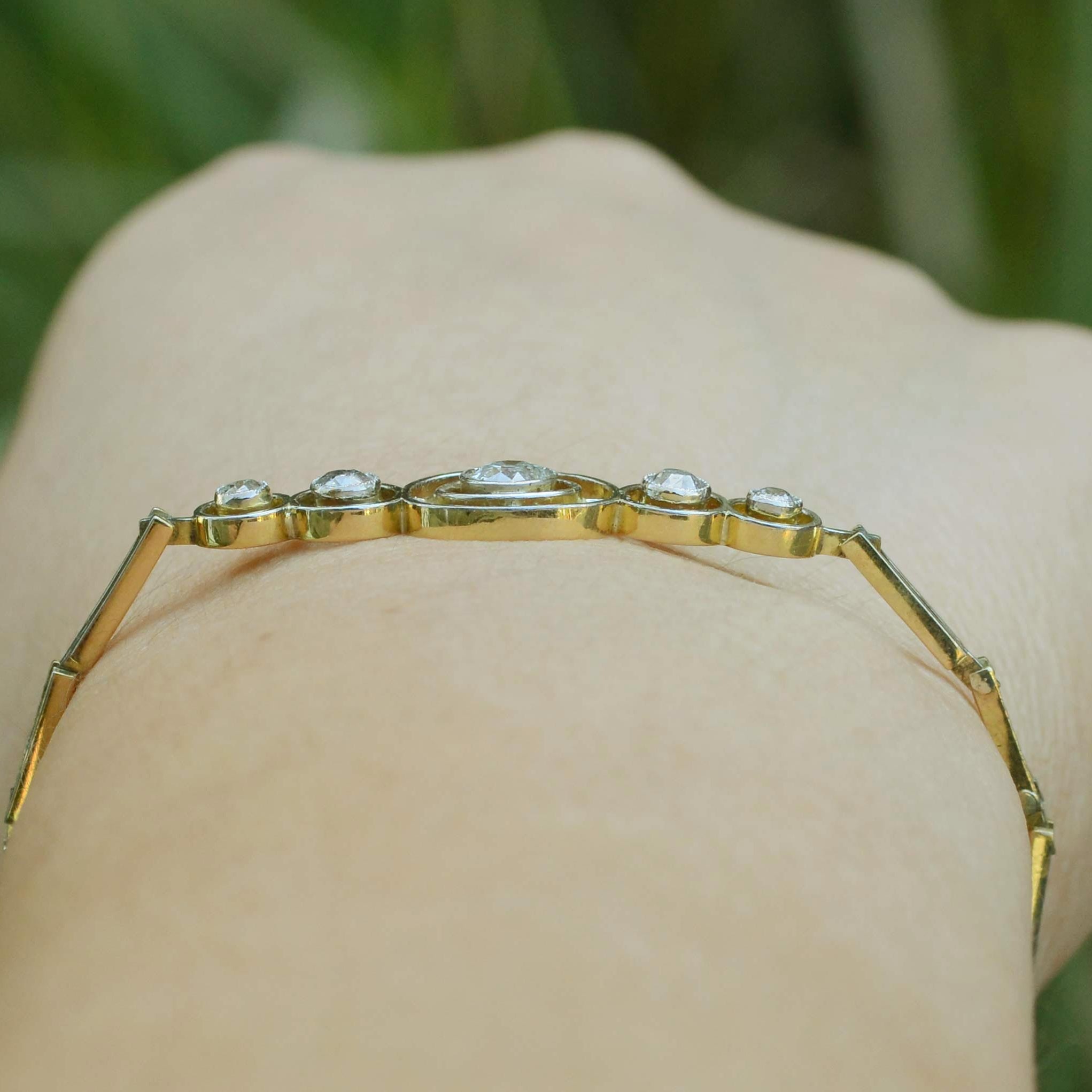 Over a half carat of old mine diamonds are in this 5 bezel setting bracelet.