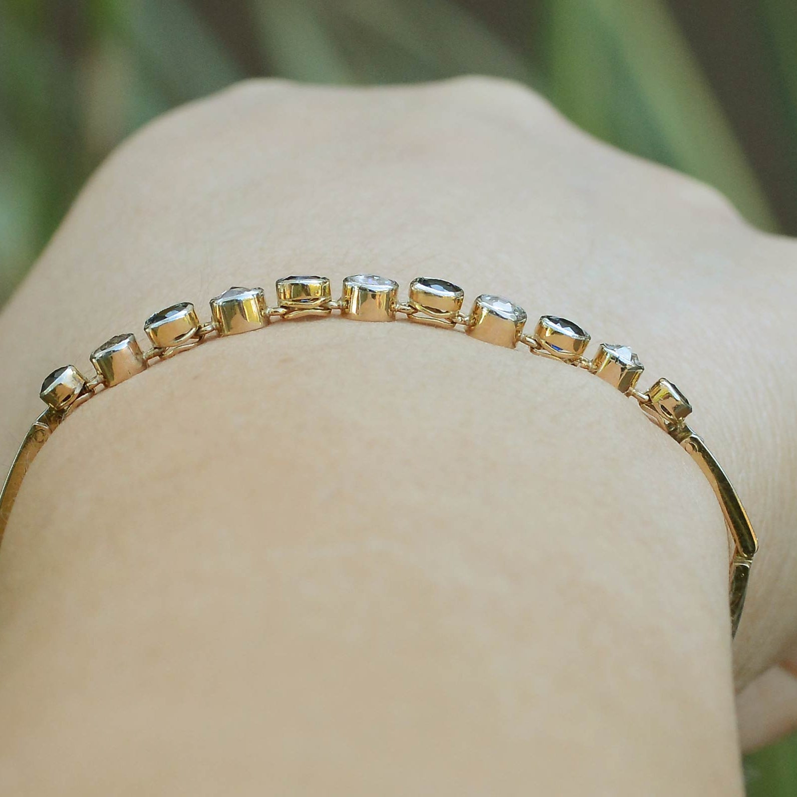 Distinguishable, alternating gems, each set in their own collet in this line bracelet.