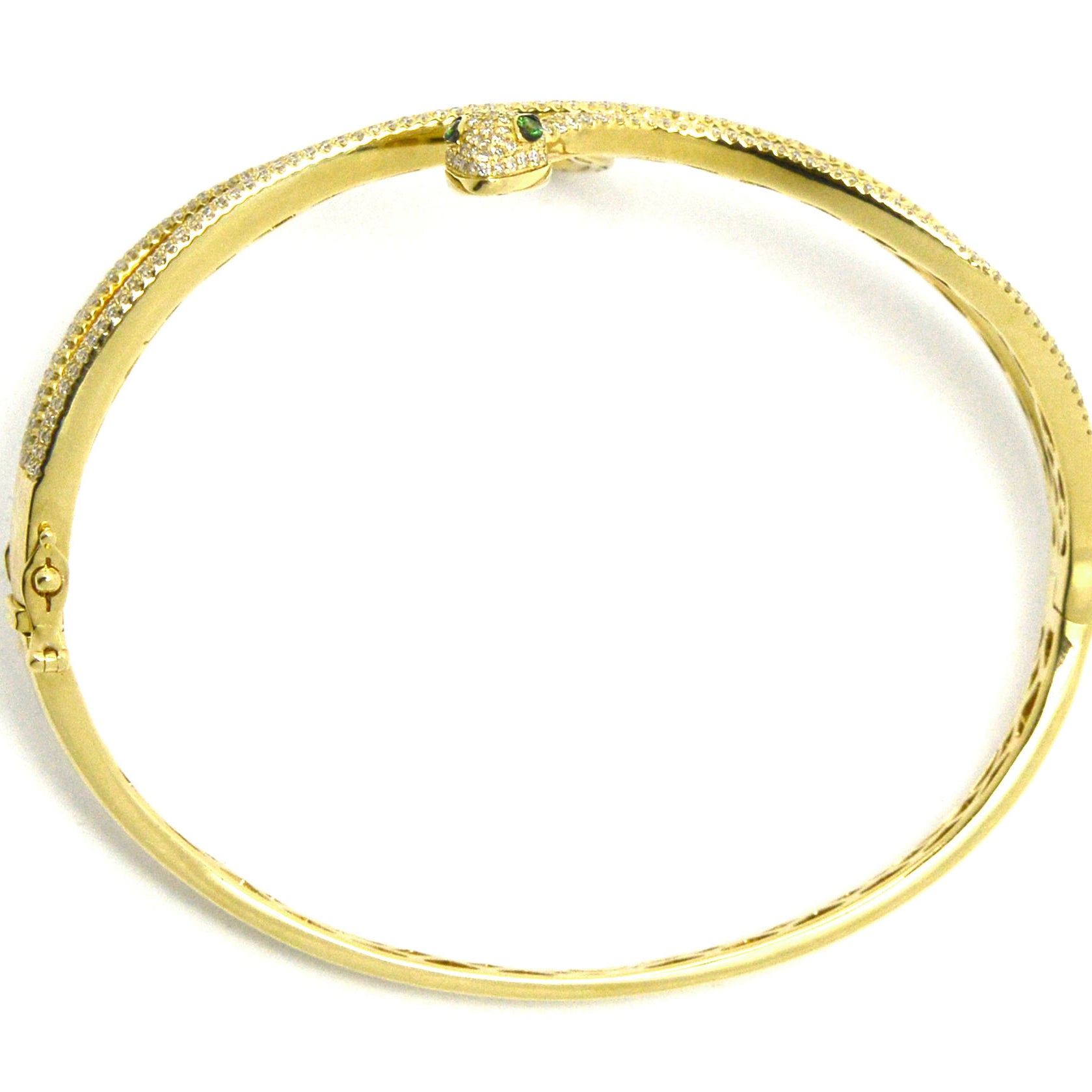 A modern gold snake bracelet design with diamonds and green tsavorite gem eyes.