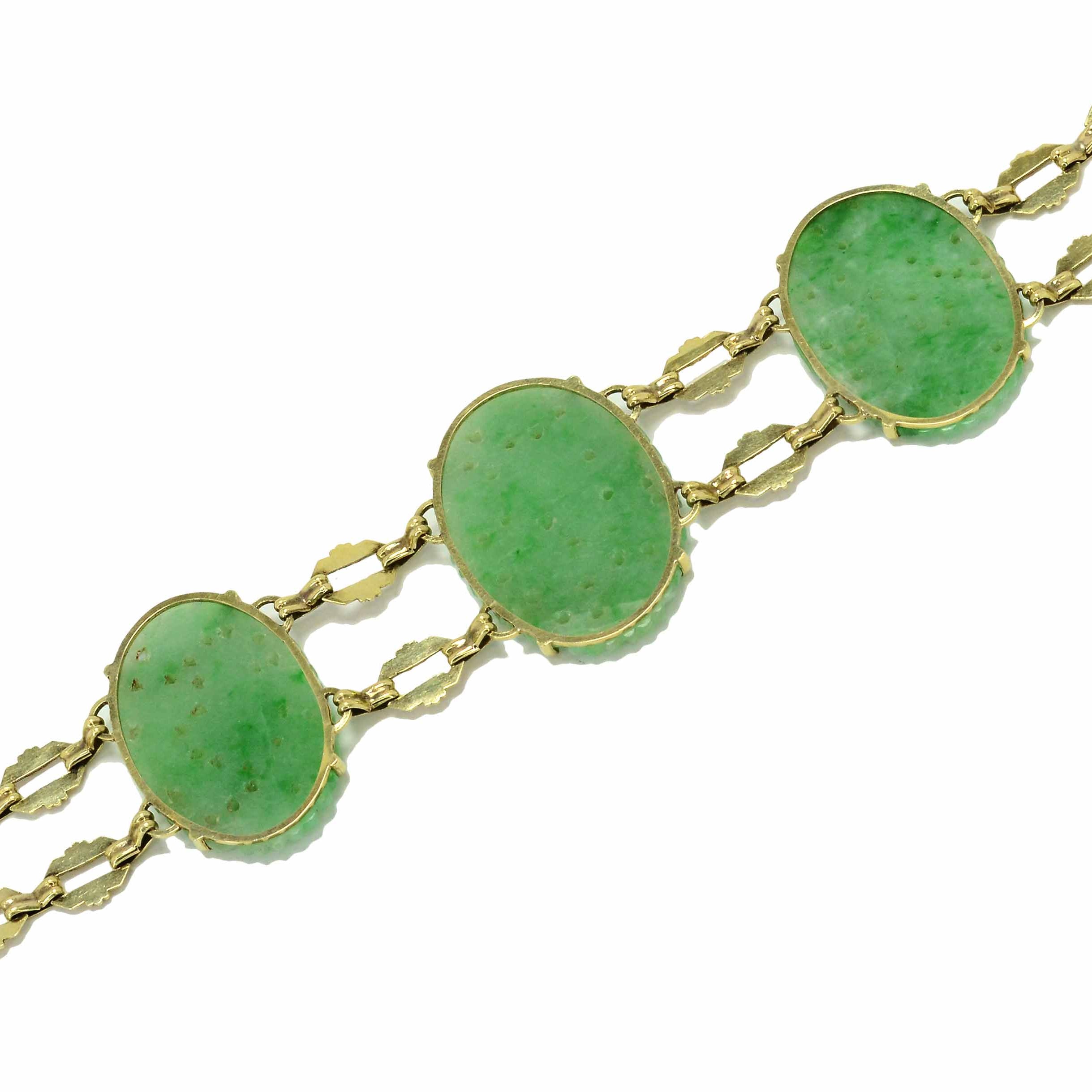 Oval jade, filigree gold link antique bracelet.
