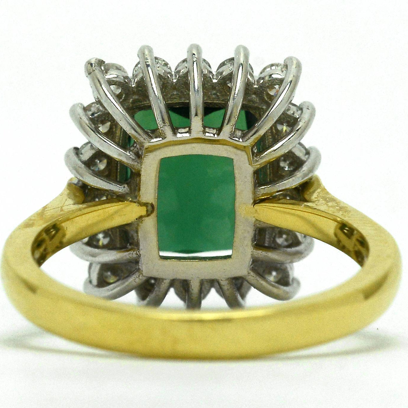 A large, 3 carat green tourmaline in a white gold basket ring setting.
