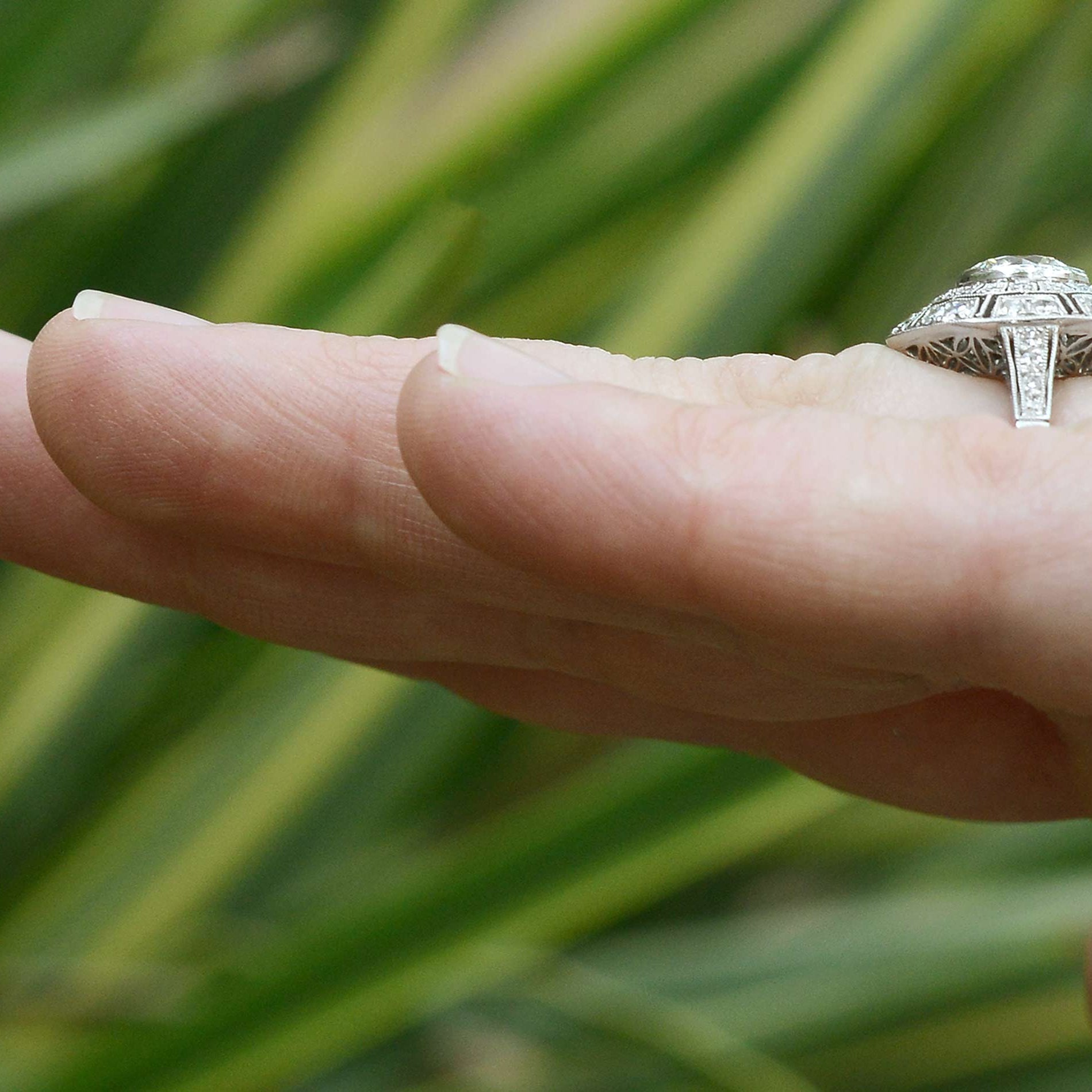 New Art Deco platinum diamond cluster engagement ring.