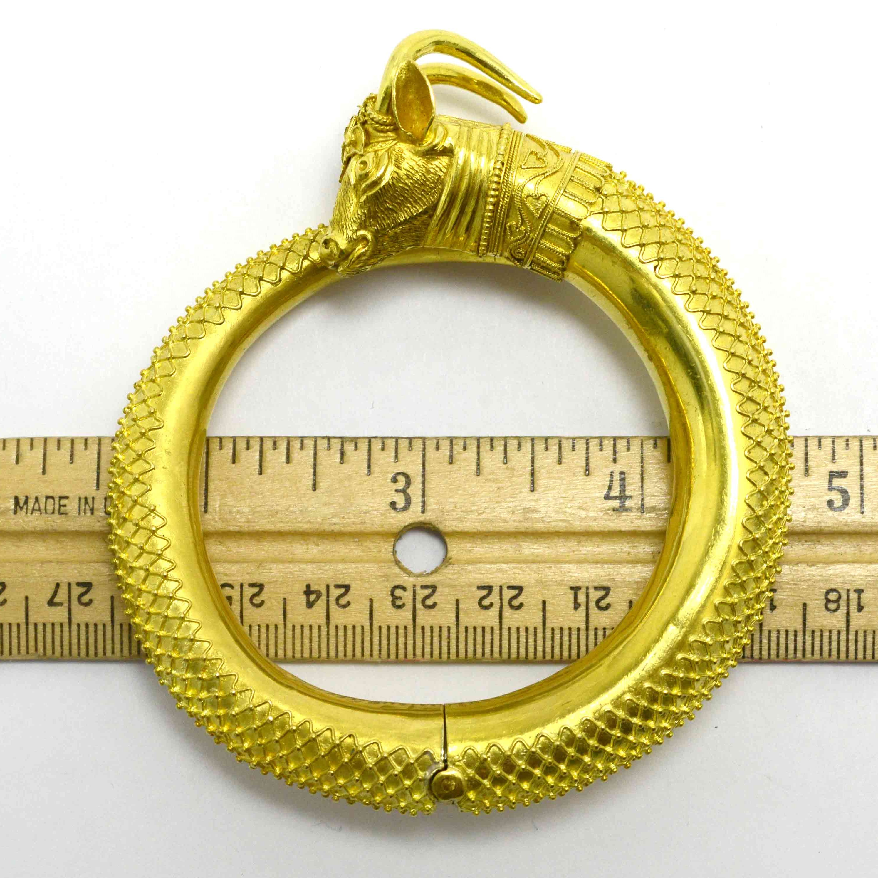 A rounded heavy, 22k high karat gold animal bracelet.