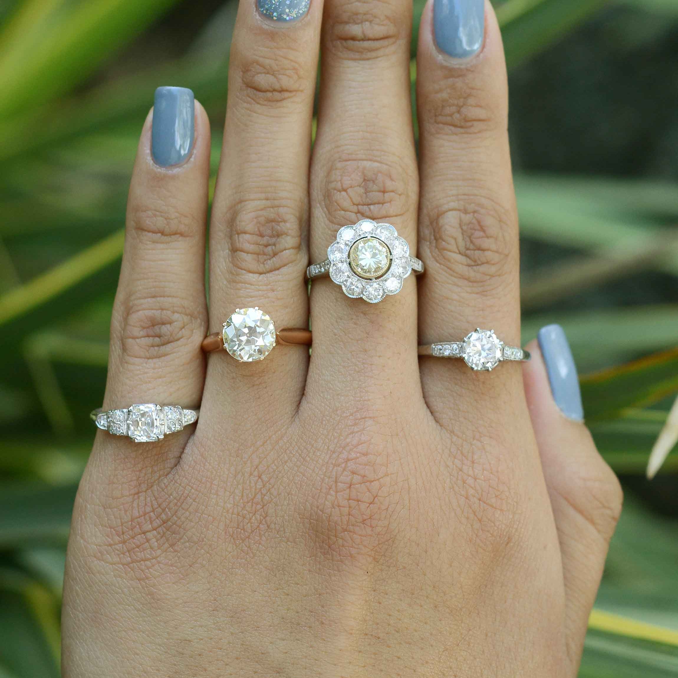A variety of antique diamond engagement rings in different metal options.