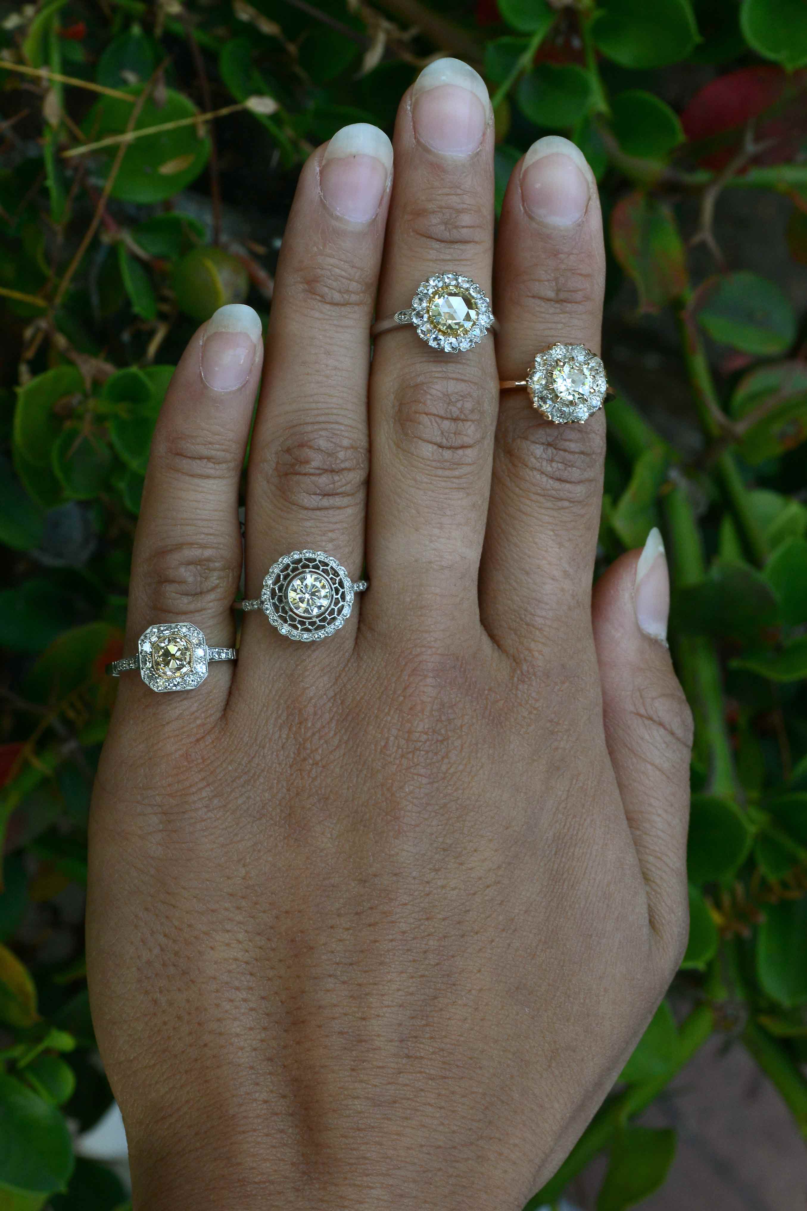 Antique revival diamond halo cluster rings.