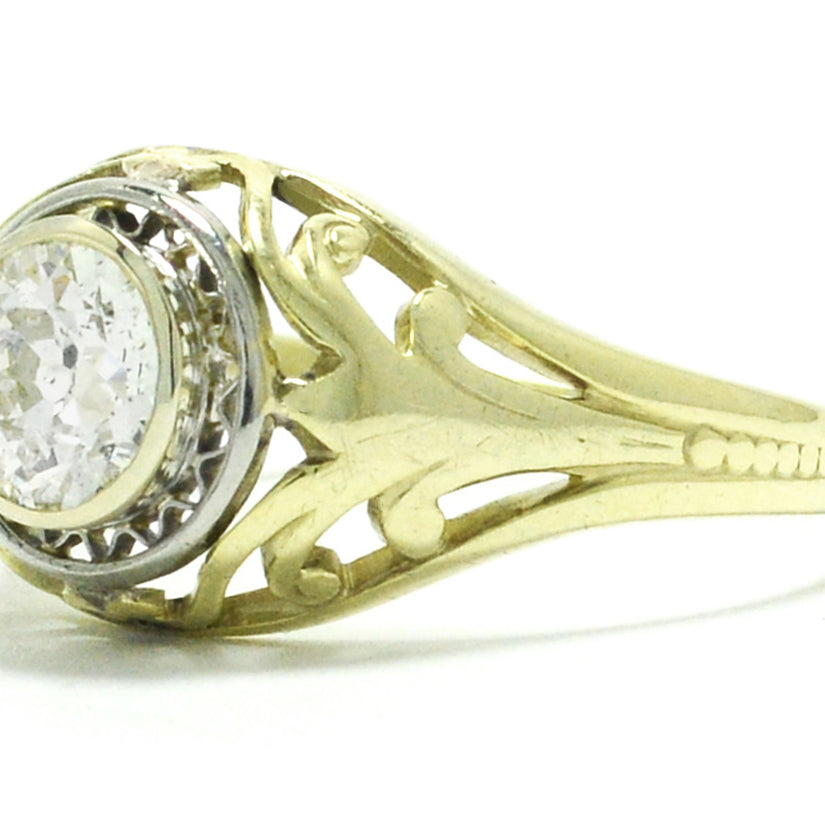 A stunning antique, 14k gold engagement ring with a unique illusion setting.