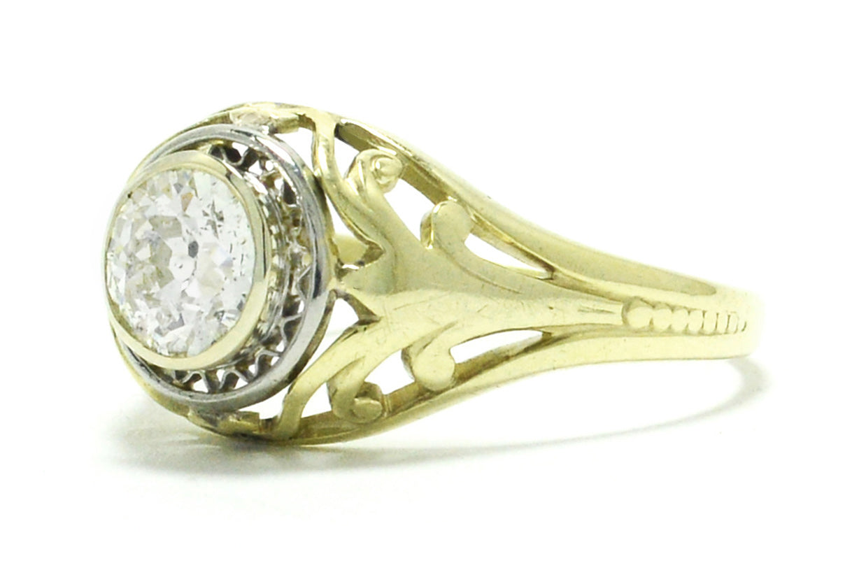 A stunning antique, 14k gold engagement ring with a unique illusion setting.