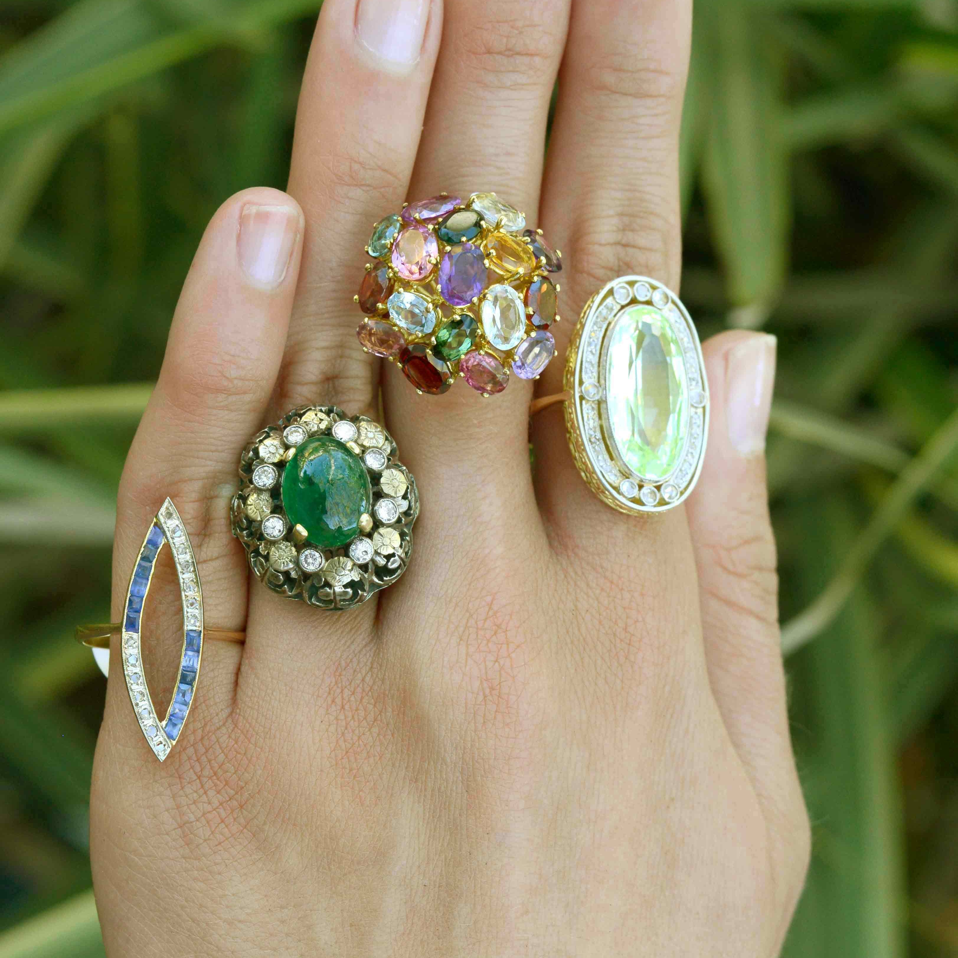 A collection of dome gemstone and diamond cocktail rings.